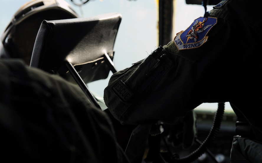 MOODY AIR FORCE BASE, Ga. -- Capt. Adam Harris, 71st Rescue Squadron navigator, wears the 23rd Wing and a rescue patch symbolizing the history and mission of Moody here Oct. 17. Airmen from the 71st Rescue Squadron, use state-of-the-art navigation, communication and radar systems to aid in the personnel recovery missions. (U.S. Air Force photo by Airman 1st Class Joshua Green)