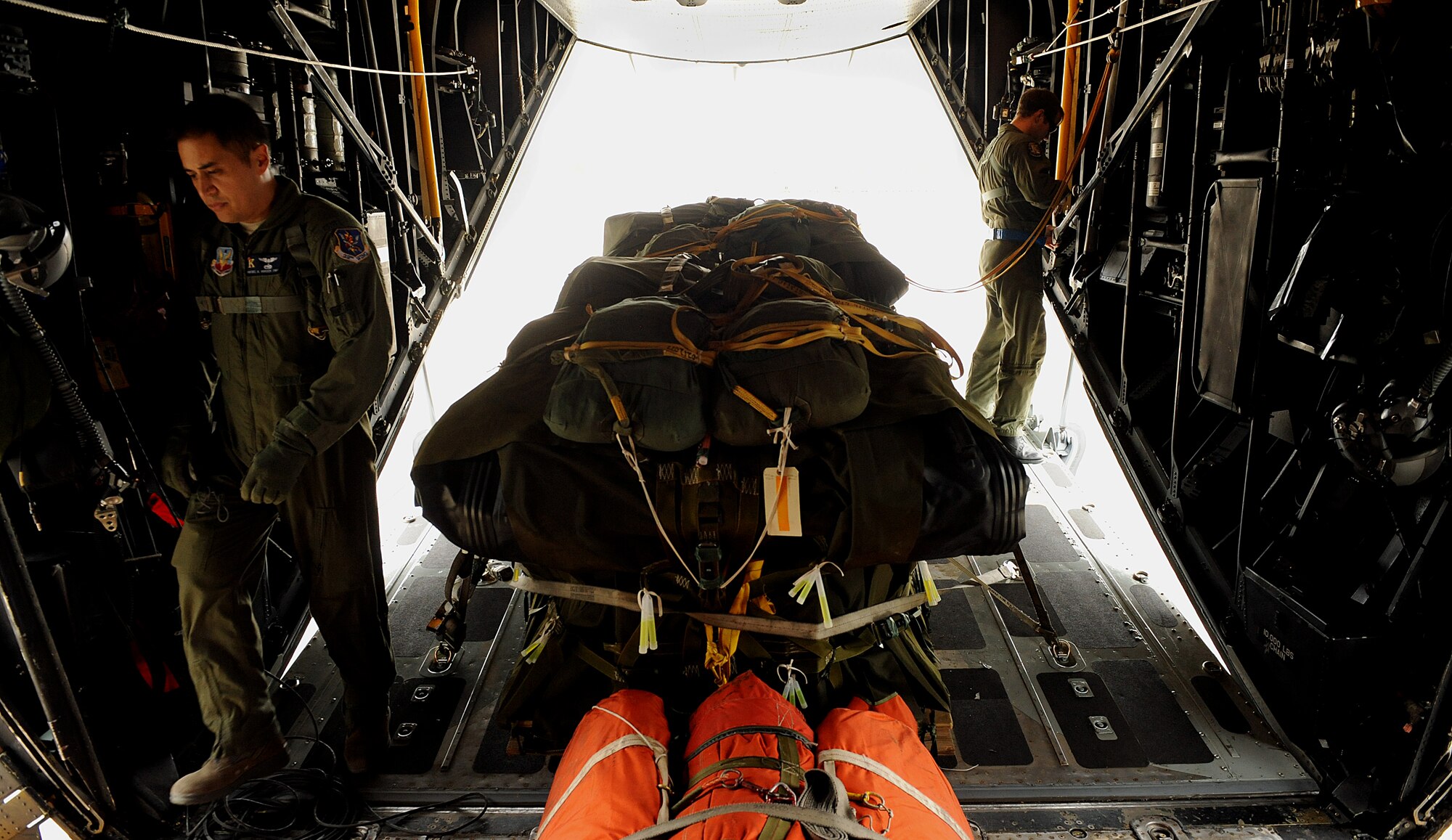MOODY AIR FORCE BASE, Ga. -- Tech. Sgt. Rafael Orozco and Senior Airman Jared Delong, 723rd Aircraft Maintenance Squadron loadmasters, prepare a HC-130P Combat King for flight in support of a search and rescue mission over the Atlantic Ocean here Oct. 17. The 347th Rescue Group participated in search efforts to locate a missing F-16 Fighting Falcon pilot from Shaw Air Force Base, S.C., who was involved in a mid-air collision. (U.S. Air Force photo by Airman 1st Class Joshua Green)