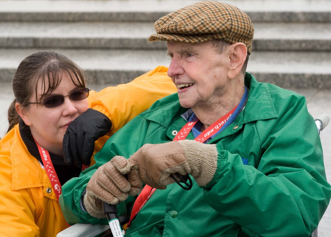 LANGLEY AIR FORCE BASE, Va. – Tom Hughes, a World War II veteran, tours the National World War II Memorial with Tech. Sgt. Lorrie McCarty, 735th Supply Chain Management Group division training non-commissioned officer-in-charge, in Washington, D.C., Oct. 17.  Twice a year, the Honor Flight Historic Triangle Virginia, and Langley volunteers, chauffeur veterans to the WW II memorial in Washington, D.C.  (U.S. Air Force photo/Staff Sgt. Barry Loo)
