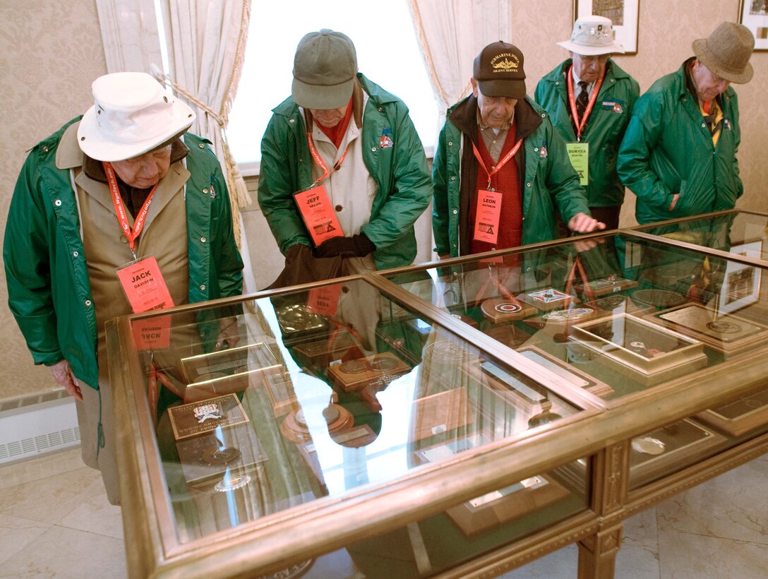LANGLEY AIR FORCE BASE, Va. – World War II veterans observe military memorabilia at the Tomb of the Unknowns in Arlington, Va., Oct. 17. Twice a year, the Honor Flight Historic Triangle Virginia, and Langley volunteers, chauffeur veterans to the WW II memorial in Washington, D.C.  (U.S. Air Force photo/Staff Sgt. Barry Loo)