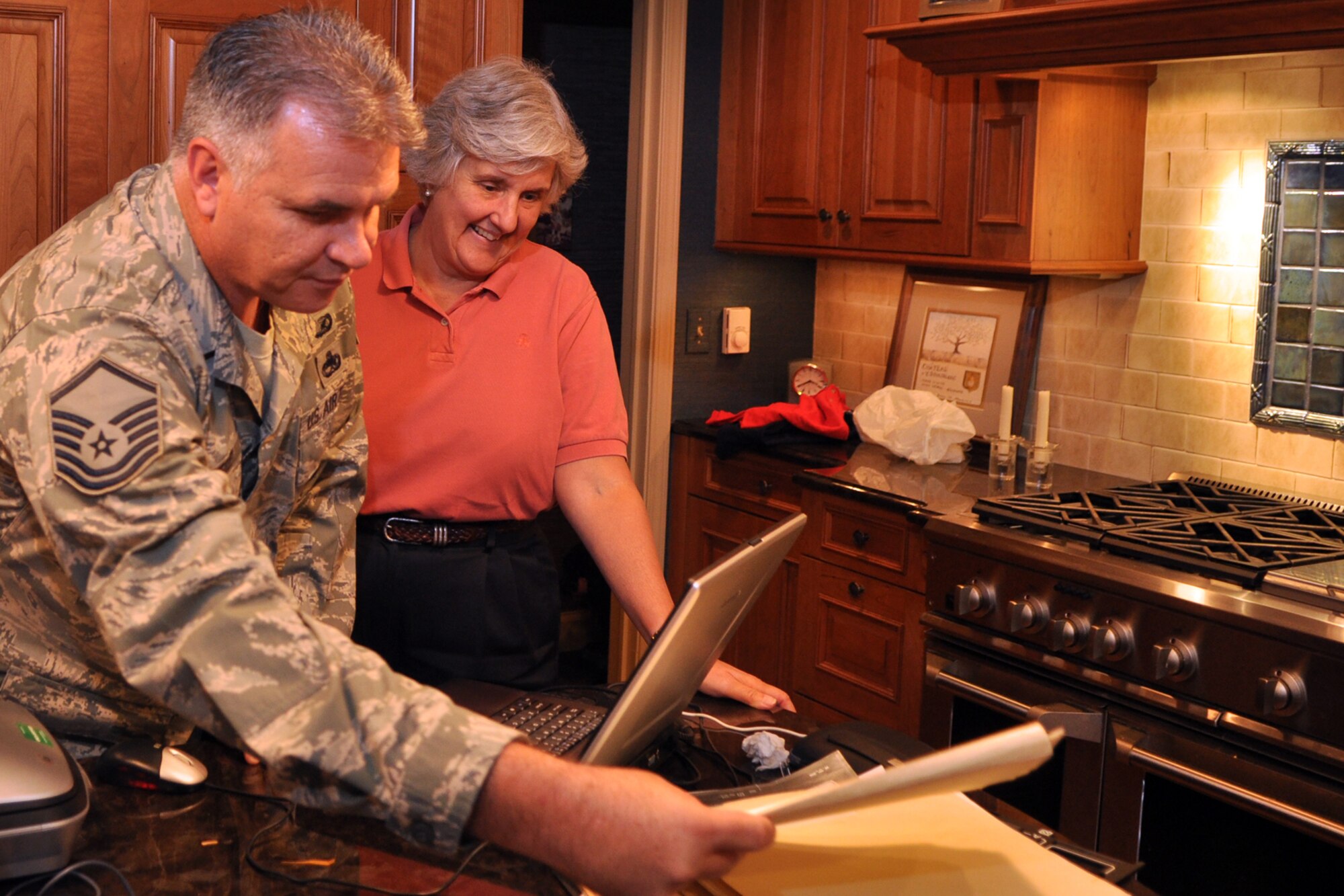 Master Sgt. Greg Steele, 47th Fighter Squadron, visual information specialist, and Susan d’Olive Mozena, daughter of 1st Lt. Charles R. D’Olive, a WWI Ace, prepares to scan more documents about eh history of the 93rd Bomb Squadron, October, 10, 2009. Sergeant Steele traveled to Detroit, Mich., to gather photos and documents from Mrs. d’Olive Mozena concerning her father’s role in the history of the 93rd BS, which is part of the 917th Wing at Barksdale Air Force Base, La. The items will be used in historic displays at the 917th Wing headquarters building in the future. (U.S. Air Force photo/Tech. Sgt. Jeff Walston)