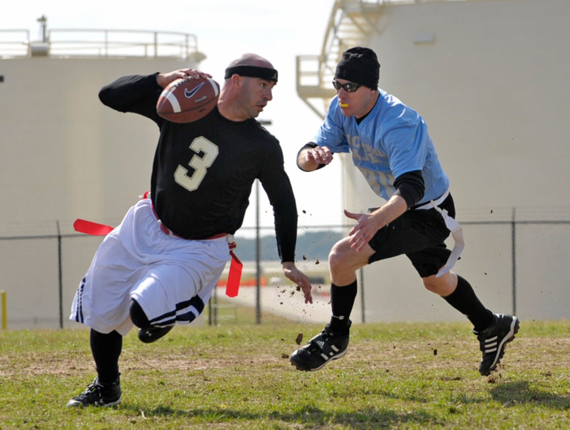 Staff Sgt. Jeremiah Babcock chases down an opposing quarterback during an Air Force versus Army flag-football game at McConnell Air Force Base, Kan., Saturday. Sergeant Babcock is assigned to the aircraft maintenance squadron of the 931st Air Refueling Group, a Reserve associate unit to the Regular force 22nd Air Refueling Wing at McConnell. The Soldiers from Fort Riley defeated the McConnell Airmen, 28-12. (U.S. Air Force photo/Master Sgt. Jason Schaap)