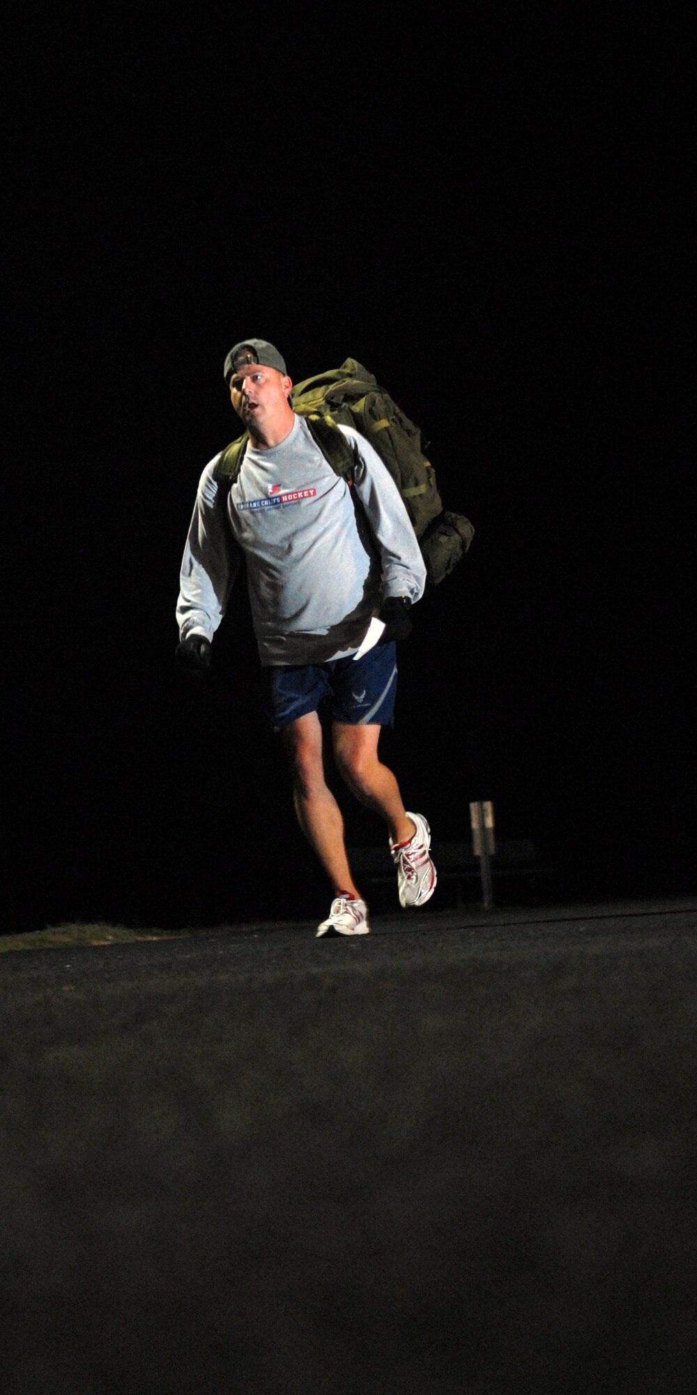 VANDENBERG AIR FORCE BASE, Calif. - With an estimated 45 pounds strapped to his back, Tech. Sgt. Paul Landreth, of the 30th Security Forces Squadron, runs two miles during the kick off of “A Run to Remember” here Monday, Oct. 19, 2009. The 2nd Annual Run to Remember provides all active duty military members, Department of Defense civilians, contractors and retirees the opportunity to run a mile for servicesmembers who died in support of Operations Enduring and Iraqi Freedom. (U.S. Air Force photo/Airman 1st Class Angelina Drake)