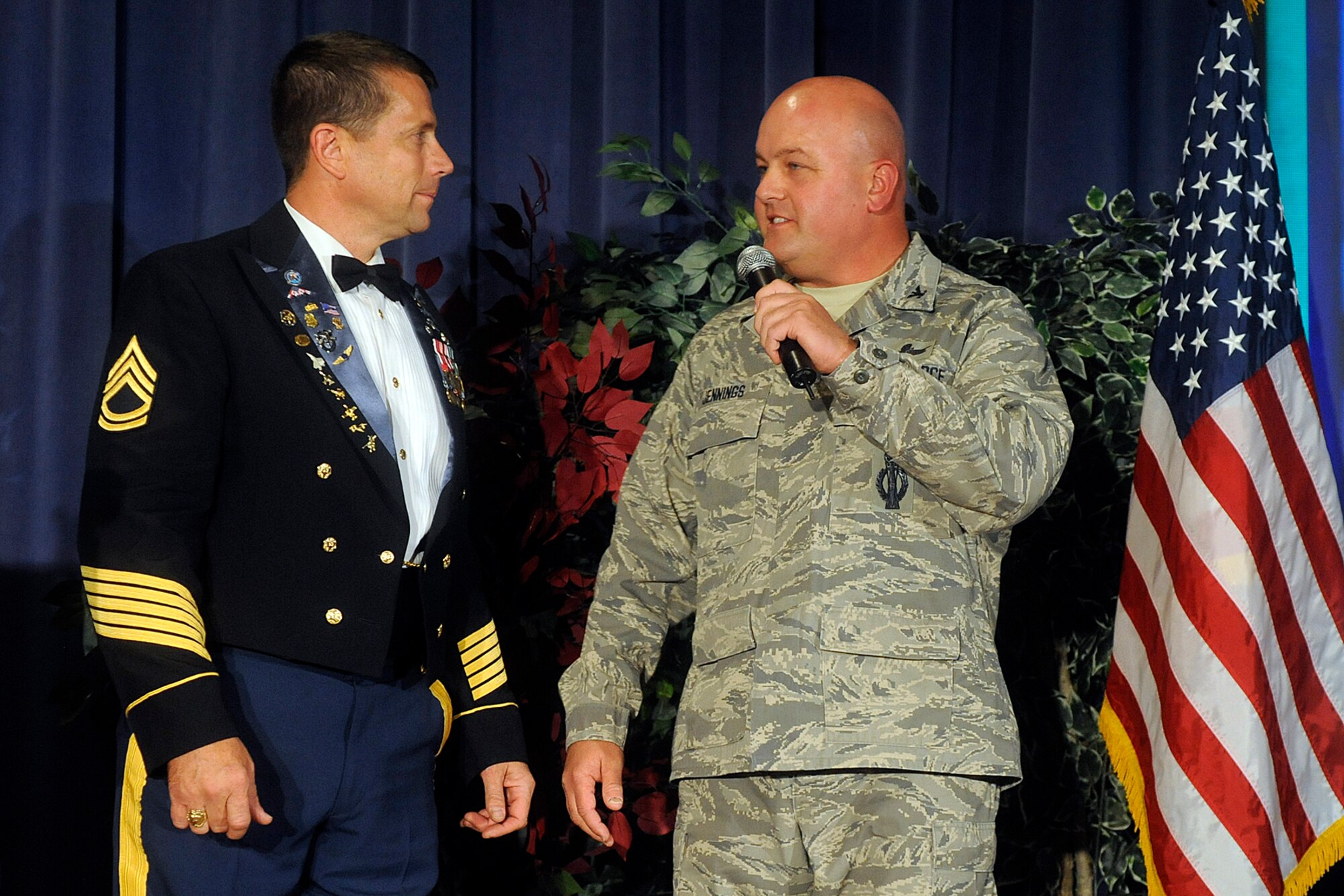 Col. Jim Jennings, Peterson Air Force Base 21st Space Wing vice commander, (right) thanks retired Army Sgt. 1st Class Dana Bowman for his visit. Mr. Bowman, a double amputee who lost his legs in a 1994 parachute training accident, spoke to Peterson Airmen Nov. 16 as part of National Disability Employment Awareness Month. Peterson aims to become an employer of choice in the disability community through its new outreach and special emphasis program. (Air Force photo by Larry Hulst)

