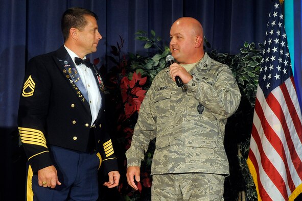 Col. Jim Jennings, Peterson Air Force Base 21st Space Wing vice commander, (right) thanks retired Army Sgt. 1st Class Dana Bowman for his visit. Mr. Bowman, a double amputee who lost his legs in a 1994 parachute training accident, spoke to Peterson Airmen Nov. 16 as part of National Disability Employment Awareness Month. Peterson aims to become an employer of choice in the disability community through its new outreach and special emphasis program. (Air Force photo by Larry Hulst)


