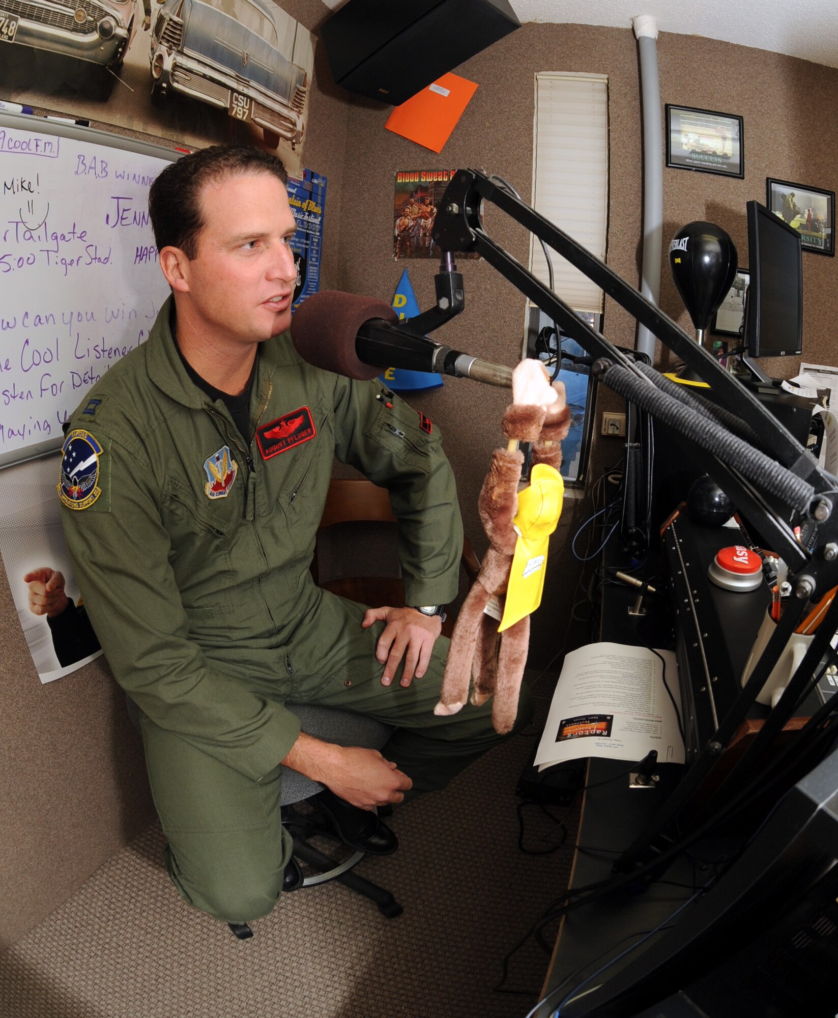 ALAMOGORDO, N.M. -- Capt. August Pfluger, 49th Fighter Wing Open House director, speaks with Mike Mason during a 107 COOL FM radio show here, Oct. 16, about the upcoming Open House "Raptors and Reapers over the Southwest," scheduled for Oct. 24 at Holloman Air Force Base, N.M. Captain Pfluger said this Open House will be the most unique open house with three international air forces performing - Canadian, German and U.S. (U.S. Air Force photograph by Airman 1st Class Sondra Escutia) 