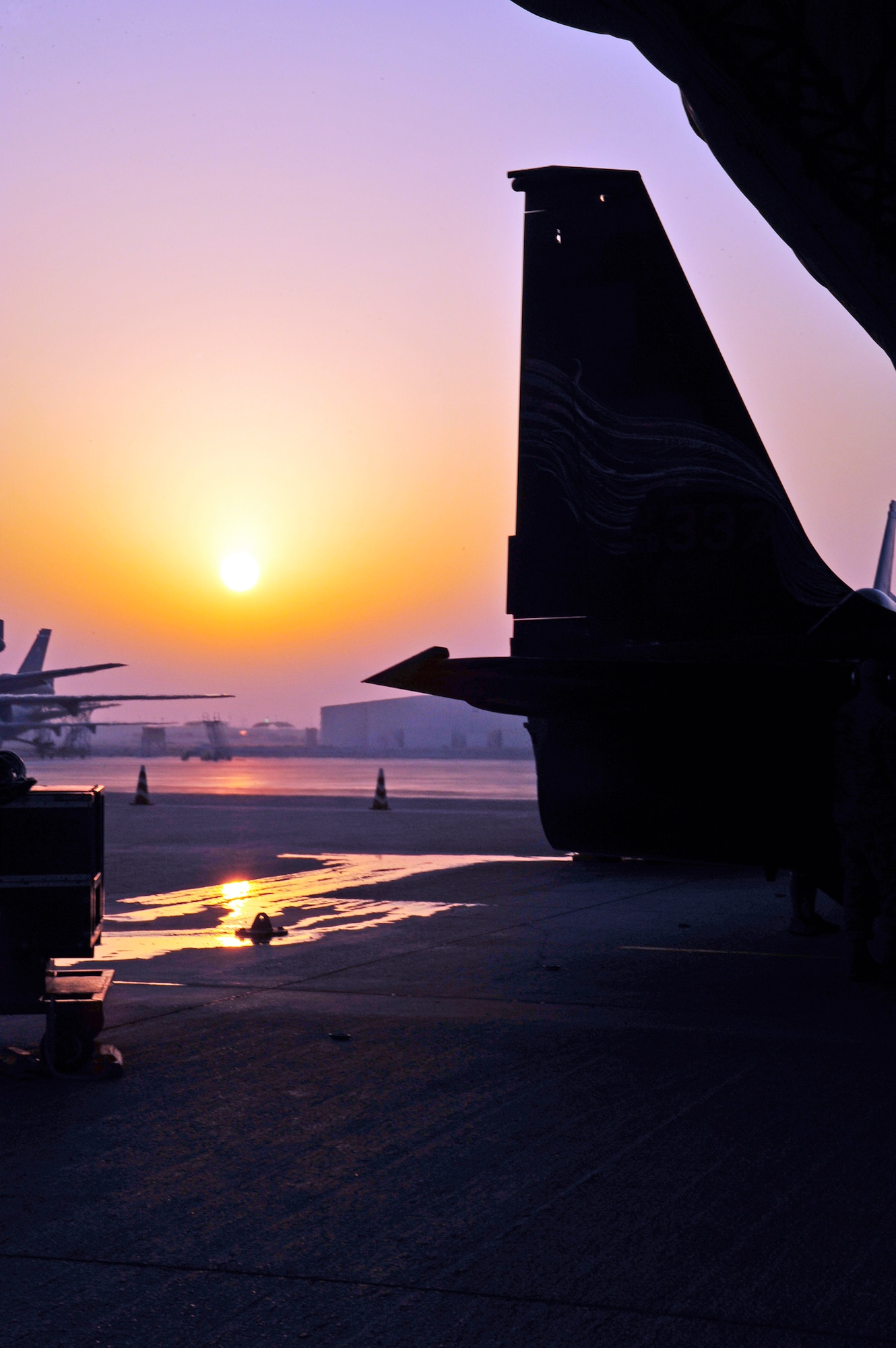 The tail of U-2 aircraft No. 068-0337 is silhouetted in the dawn of Oct. 18, 2009, at an air base in Southwest Asia. The plane was piloted by Lt. Col. Robert Wehner of the 380th Expeditionary Reconnaissance Squadron on a mission to exceed 25,000 hours of flight for the aircraft. (U.S. Air Force photo/2nd Lt. Kidron B. Vestal)