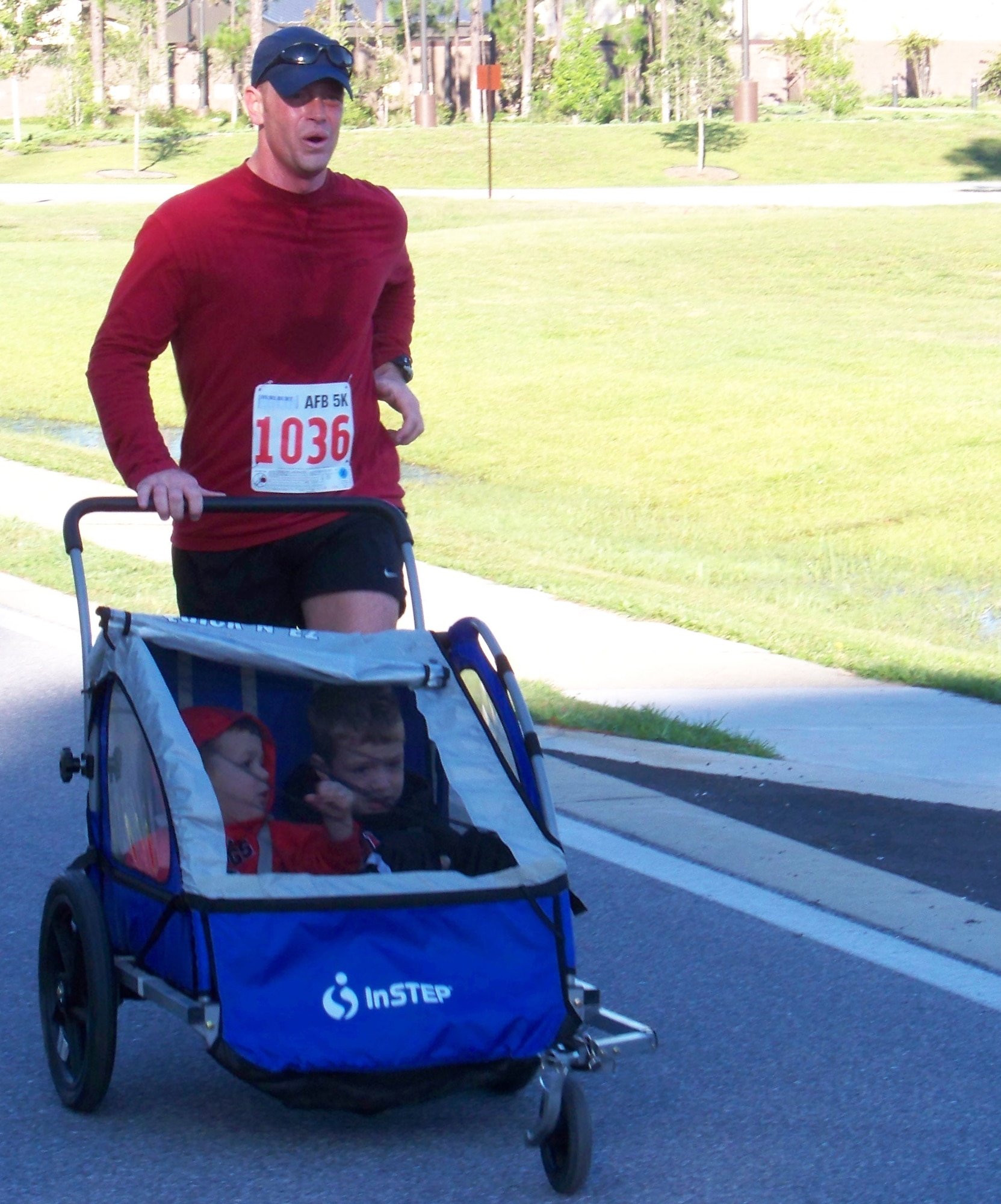 Capt. David Chancey, 373rd Training Squadron, Det. 7, pushes his sons, Mason, 4, left, and Davis, 5, while participating in the 5k Commando Run at the Aderholt Fitness Center at Hurlburt Field Oct. 17. This was the boys first 5k run.  (Air Force photo by Airman 1st Class Joe McFadden.)