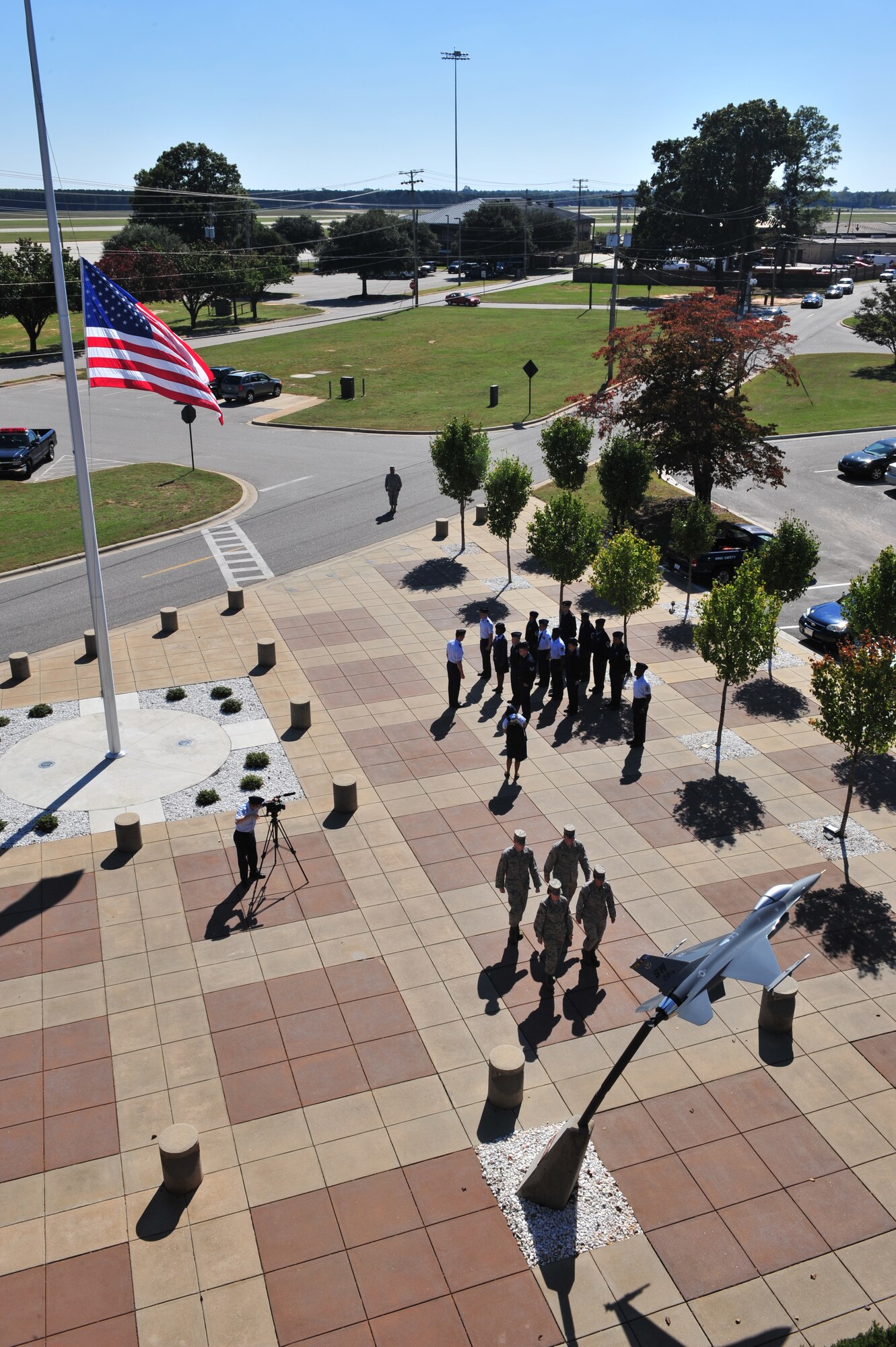 Shaw Air Force Base, S.C. -- Members of the 20th Fighter Wing conclude the half-staffing of the base colors in honor of the fallen Capt. Nicholas Giglio, a pilot of the 77th Fighter Squadron who died in a mid-air collision over the Atlantic, Oct. 19. (US Air Force Photo by: Tech. Sgt. Josef Cole)
