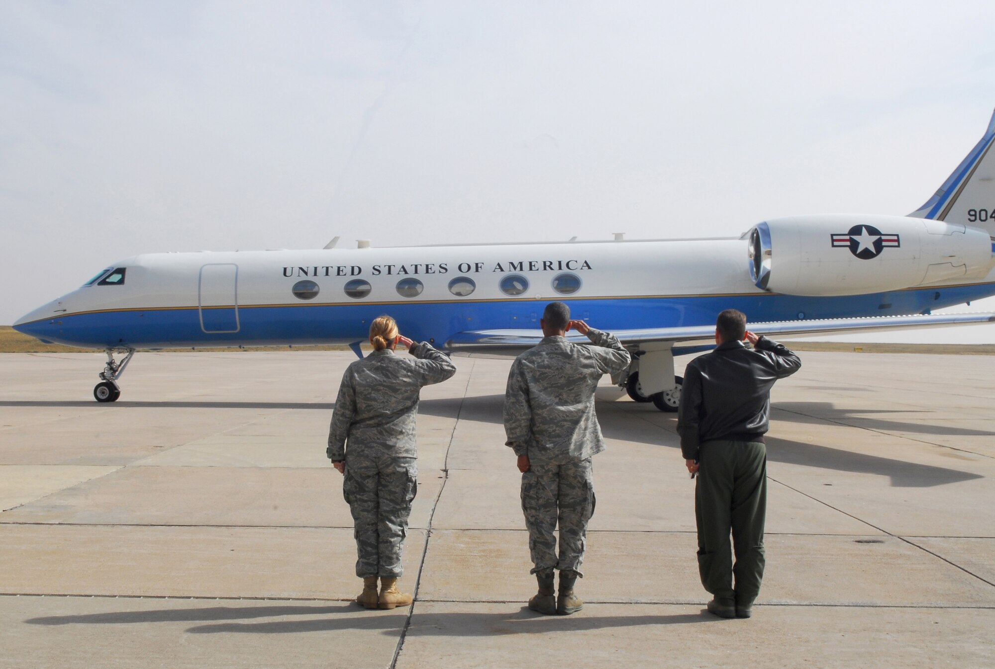BUCKLEY AIR FORCE BASE, Colo. -- Col. Clint Crosier (right), 460th Space Wing commander, Col. Vincent Jefferson (center), 460th Mission Support Group commander, and Maj. Beth Peters (left), 460th Force Support Squadron deputy commander, salute Marine Corps Gen. James Cartwright, Vice Chairman of the Joint Chiefs of Staff, during his Oct. 13 visit. (U.S. Air Force Photo by Staff Sgt. Anika Williams)