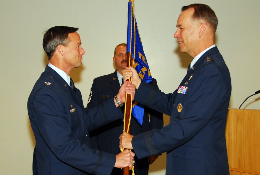Col. Jon Mott assumes command of the Air National Guard Air Force Reserve Command Test Center with a symbolic passing of the AATC guideon from Maj. Gen. Rick Moisio, Air National Guard deputy director, Oct. 16. (Air National Guard photo by Master Sgt. Dave Neve)