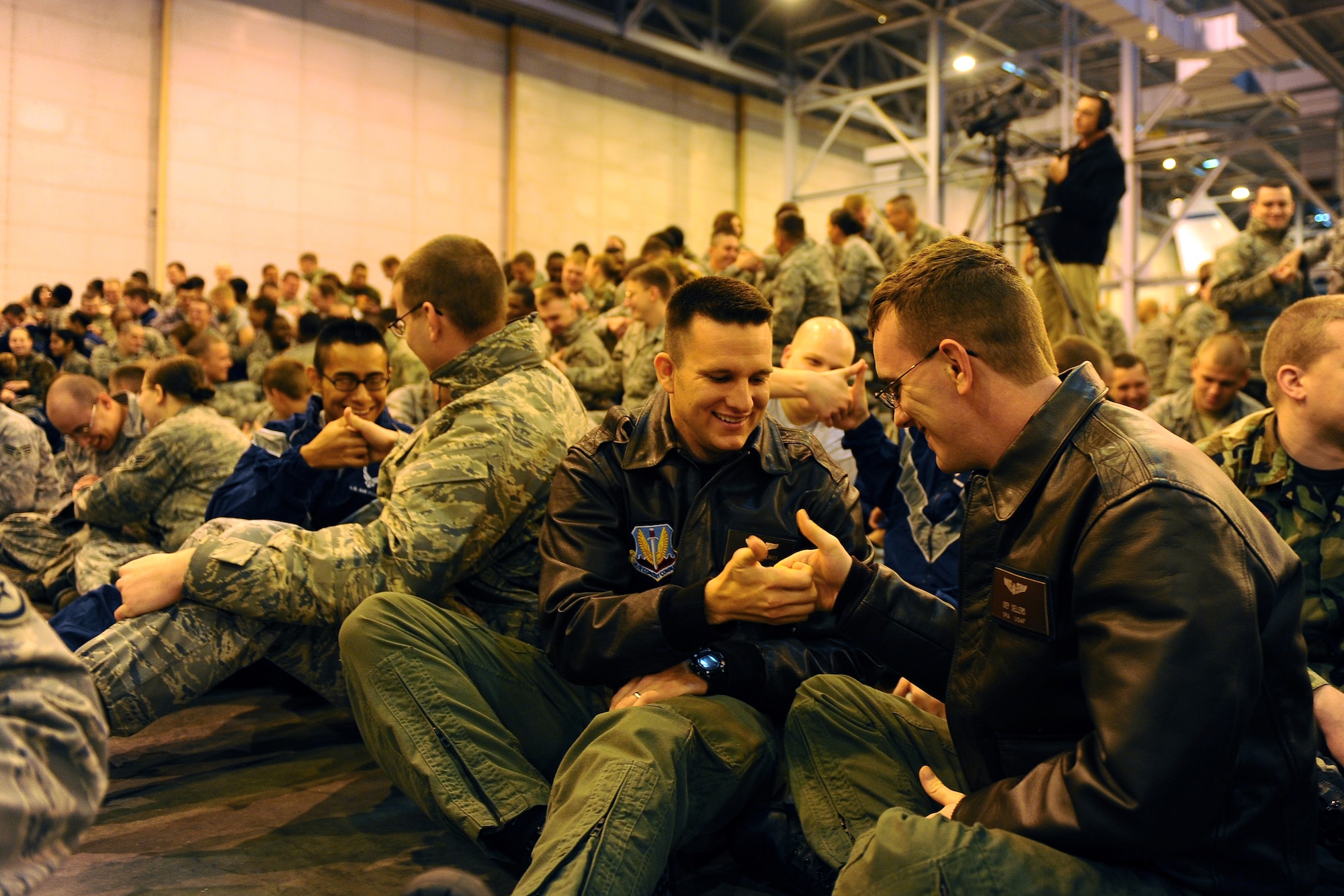 OFFUTT AIR FORCE BASE, Neb. - Senior Airmen Joey Sellers (right) and Brandon Weaver thumb wrestle as part of an interactive Commander's Call led by keynote speaker Craig Zablocki inside the Bennie Davis Maintenance Facility's Dock 1 as part of Wingman Day, Oct. 16.  Wingman Day is a day set aside to build comraderie and teamwork to better the Air Force's greatest asset, its Airmen.

U.S. Air Force Photo by Josh Plueger
