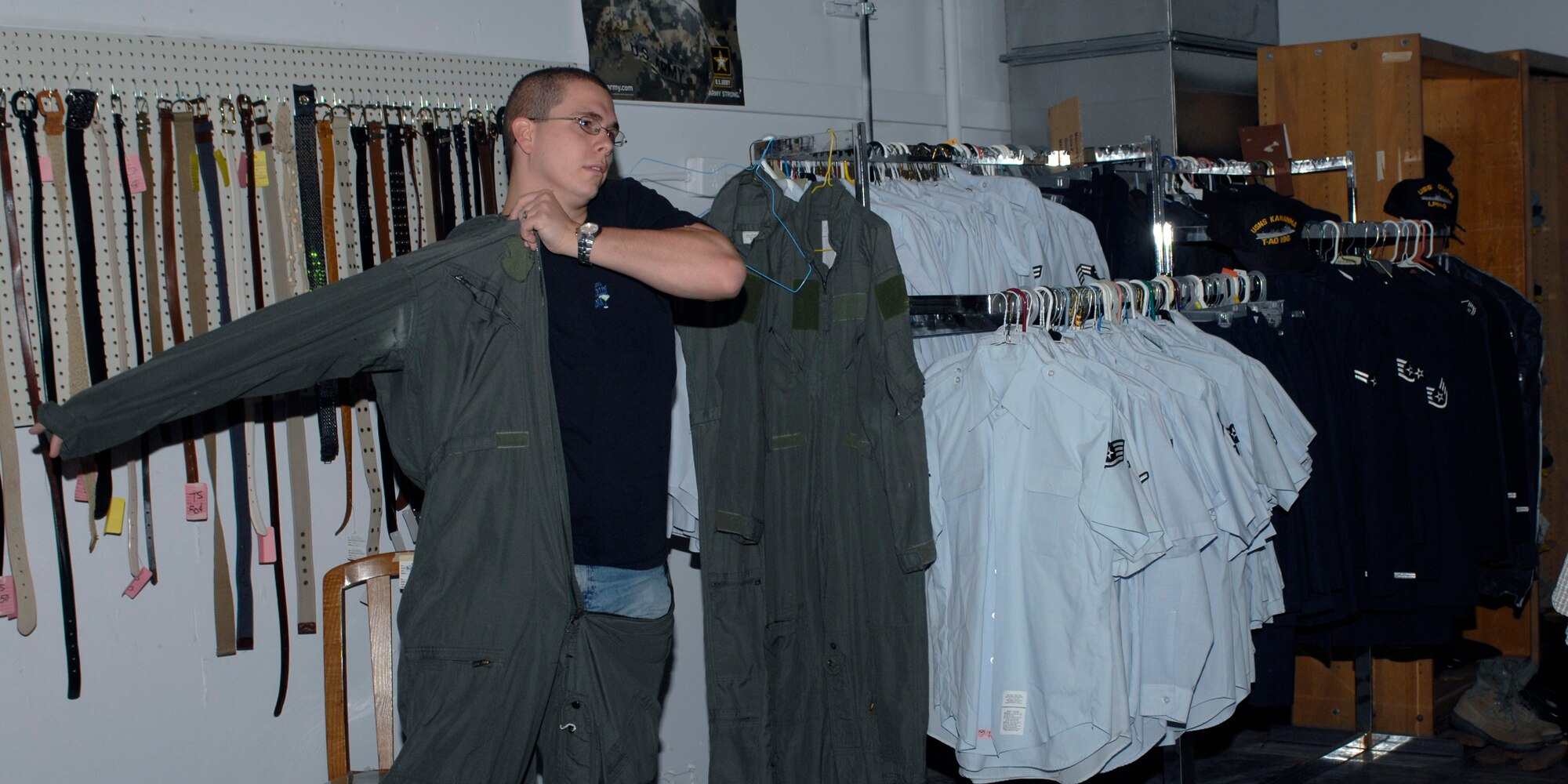 CANNON AIR FORCE BASE, N.M.-- Airman 1st Class David Clifford, 27th Special Operations Aircraft Maintenance Squadron, tries on a donated flight suit at the Thrift Store October 19.  The store is open the first and third Saturday, 9 a.m. to 1 p.m. Monday and Thursday 9 a.m. to 1 p.m., and 3 p.m. to 6 p.m. on Tuesdays.  (U.S. Air Force photo by Airman 1st Class James Bell)
