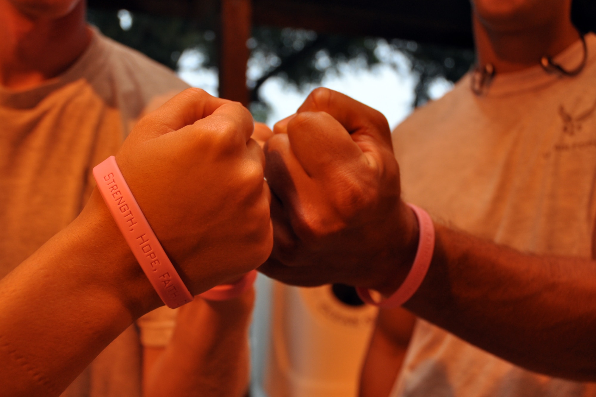 EGLIN AIR FORCE BASE, Fla. –  Runners sport pink rubber bracelet wristbands symbolizing their support for Breast Cancer Awareness Month. More than 300 people participated in the Breast Cancer Awareness Month 5K Run, Oct. 16. The event was held to raise awareness of the importance for women to self-test and catch the disease in its early stages. Capt. Scott Griffith, Operational Flight Program Combined Test Force, and Paula Piazza, 96th Medical Operations Squadron, were the first male and female to finish the run with a time of 15:58 and 18:54, respectively. (U.S. Air Force photo/ Airman Anthony Jennings)