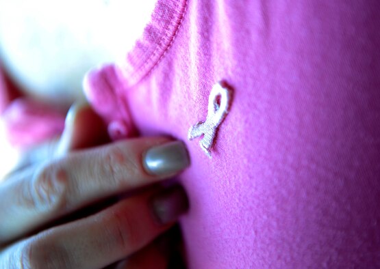 HOLLOMAN AIR FORCE BASE, N.M. -- Soaring Heights Communities handed out pink ribbons before a National Breast Cancer Awareness Month walk began here, Oct. 15. A pink ribbon is a symbol of breast cancer awareness. Individuals interested in learning more about breast cancer or how to show their support should visit www.nbcam.org for more information. (U.S. Air Force photo by Senior Airman Tiffany Trojca)