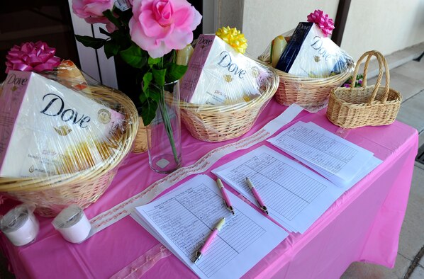HOLLOMAN AIR FORCE BASE, N.M. -- A display sits outside of the Soaring Heights Community building here, Oct.  15. More than 60 members of Team Holloman volunteered to walk one mile in honor of National Breast Cancer Awareness Month. Afterward, three participants received gift baskets filled with beauty products through a raffle. (U.S. Air Force photo by Senior Airman Tiffany Trojca)