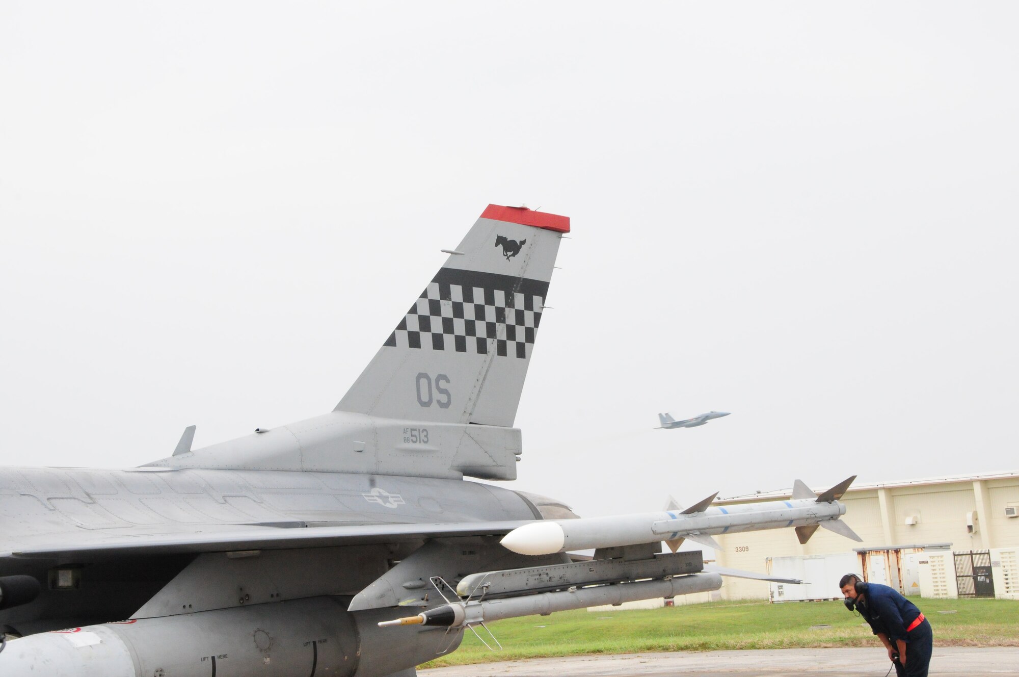 Senior Amn Luis McGraw, a crew chief with the 36th Aircraft Maintenance Unit/51st Aircraft Maintenance Squadron conducts a pre-flight inspection on an F-16 Viper from Osan Air Base during the Ryukyu Air Warrior training affair here at Kadena Air Base, 15 October, 2009. The RAW is a weeklong training event that brought together aircraft from not only other PACAF bases, but other services as well. 
(U.S. Air Force photo/Staff Sgt. Lakisha A. Croley)
