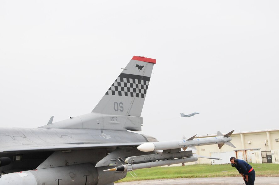 Senior Amn Luis McGraw, a crew chief with the 36th Aircraft Maintenance Unit/51st Aircraft Maintenance Squadron conducts a pre-flight inspection on an F-16 Viper from Osan Air Base during the Ryukyu Air Warrior training affair here at Kadena Air Base, 15 October, 2009. The RAW is a weeklong training event that brought together aircraft from not only other PACAF bases, but other services as well. 
(U.S. Air Force photo/Staff Sgt. Lakisha A. Croley)

