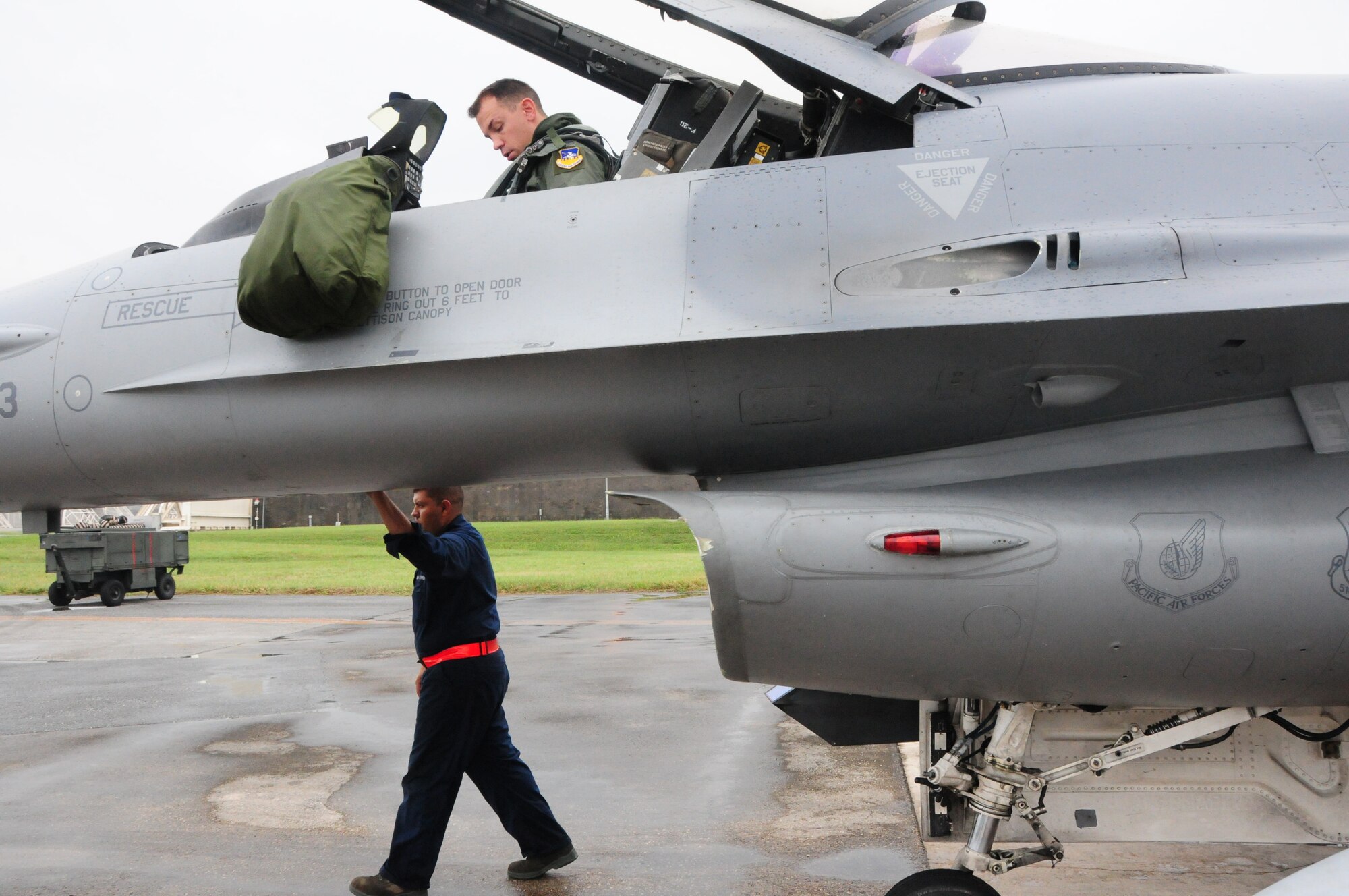 Senior Amn Luis McGraw, a crew chief with the 36th Aircraft Maintenance Unit/51st Aircraft Maintenance Squadron begins a pre-flight inspection on an F-16 Viper from Osan Air Base during the Ryukyu Air Warrior training affair here at Kadena Air Base, 15 October, 2009. The RAW is a weeklong training event that brought together aircraft from not only other PACAF bases, but other services as well. 
(U.S. Air Force photo/Staff Sgt. Lakisha A. Croley)
