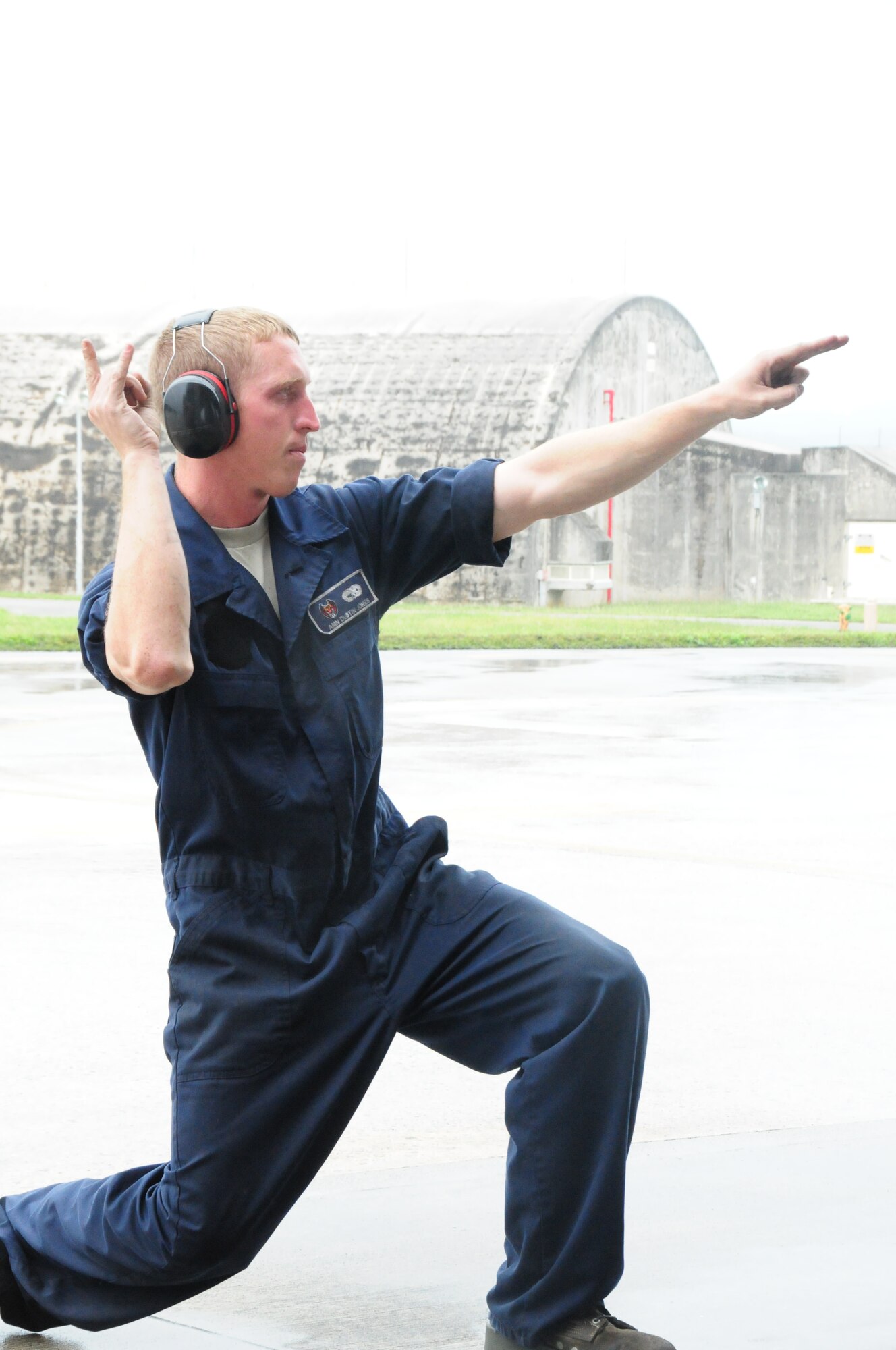 Amn 1st Class Dustin Jones, a crew chief with the 18th Aircraft Maintenance Squadron marshals out an F-15 Eagle during the Ryukyu Air Warrior training affair here at Kadena Air Base, 15 October, 2009. The RAW is a weeklong training event that brought together aircraft from not only other PACAF bases, but other services as well. 
(U.S. Air Force photo/Staff Sgt. Lakisha A. Croley)

