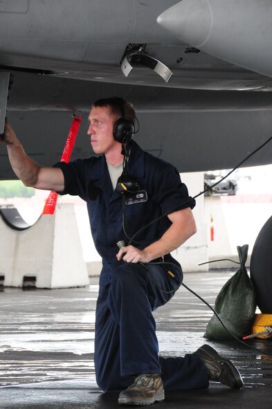 Amn 1st Class  Jeremy Cooper, a weapons load team member with the 44th Aircraft Maintenance Unit conducts pre-flight maintenance checks on an F-15  Eagle during the Ryukyu Air Warrior training affair here at Kadena Air Base, 15 October, 2009. The RAW is a weeklong training event that brought together aircraft from not only other PACAF bases, but other services as well.
(U.S. Air Force photo/Staff Sgt. Lakisha A. Croley)
