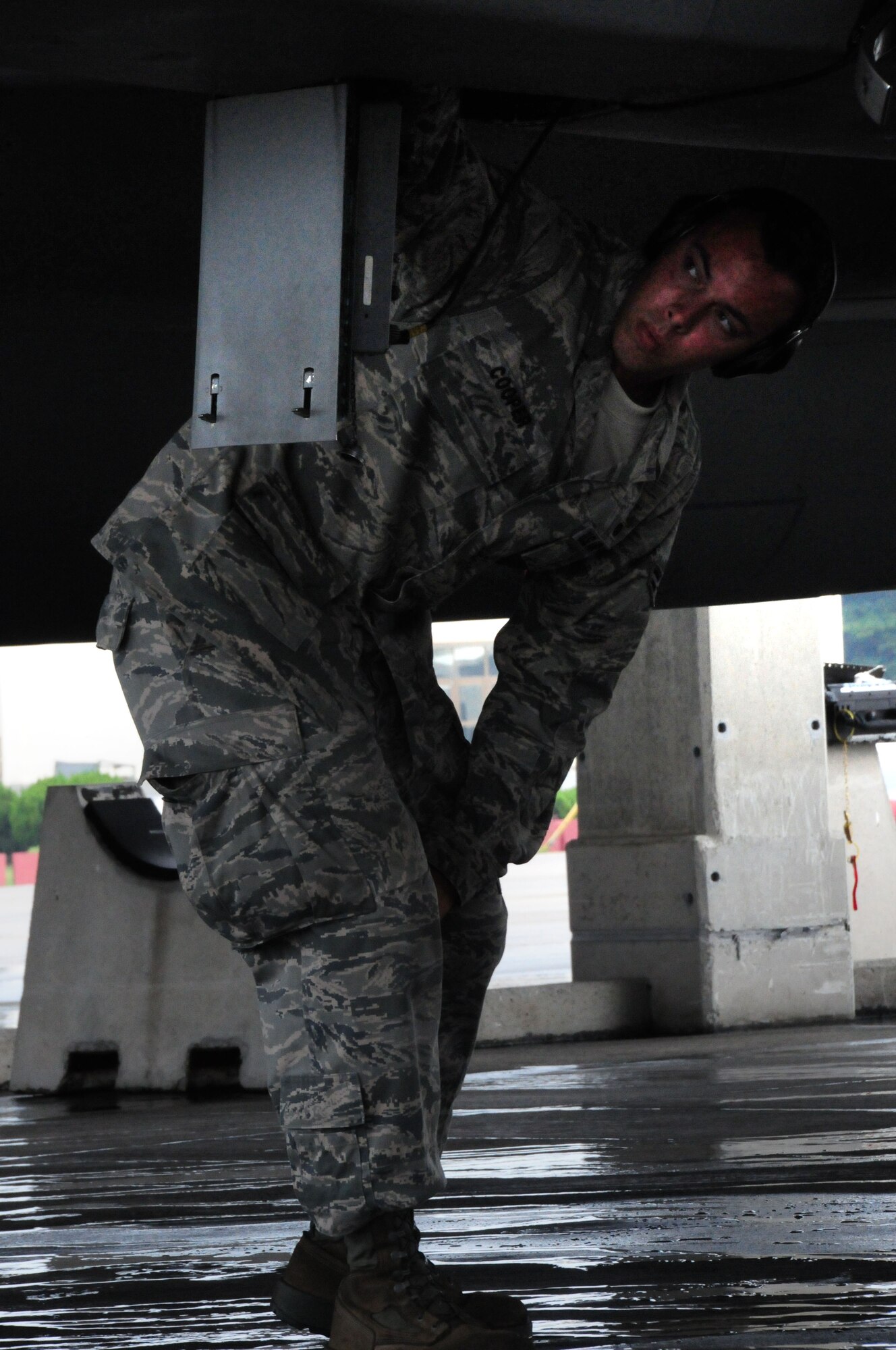 Amn 1st Class  Jeremy Cooper, a weapons load team member with the 44th Aircraft Maintenance Unit conducts pre-flight maintenance checks on an F-15  Eagle during the Ryukyu Air Warrior training affair here at Kadena Air Base, 15 October, 2009. The RAW is a weeklong training event that brought together aircraft from not only other PACAF bases, but other services as well.
(U.S. Air Force photo/Staff Sgt. Lakisha A. Croley)
