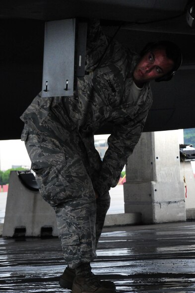 Amn 1st Class  Jeremy Cooper, a weapons load team member with the 44th Aircraft Maintenance Unit conducts pre-flight maintenance checks on an F-15  Eagle during the Ryukyu Air Warrior training affair here at Kadena Air Base, 15 October, 2009. The RAW is a weeklong training event that brought together aircraft from not only other PACAF bases, but other services as well.
(U.S. Air Force photo/Staff Sgt. Lakisha A. Croley)
