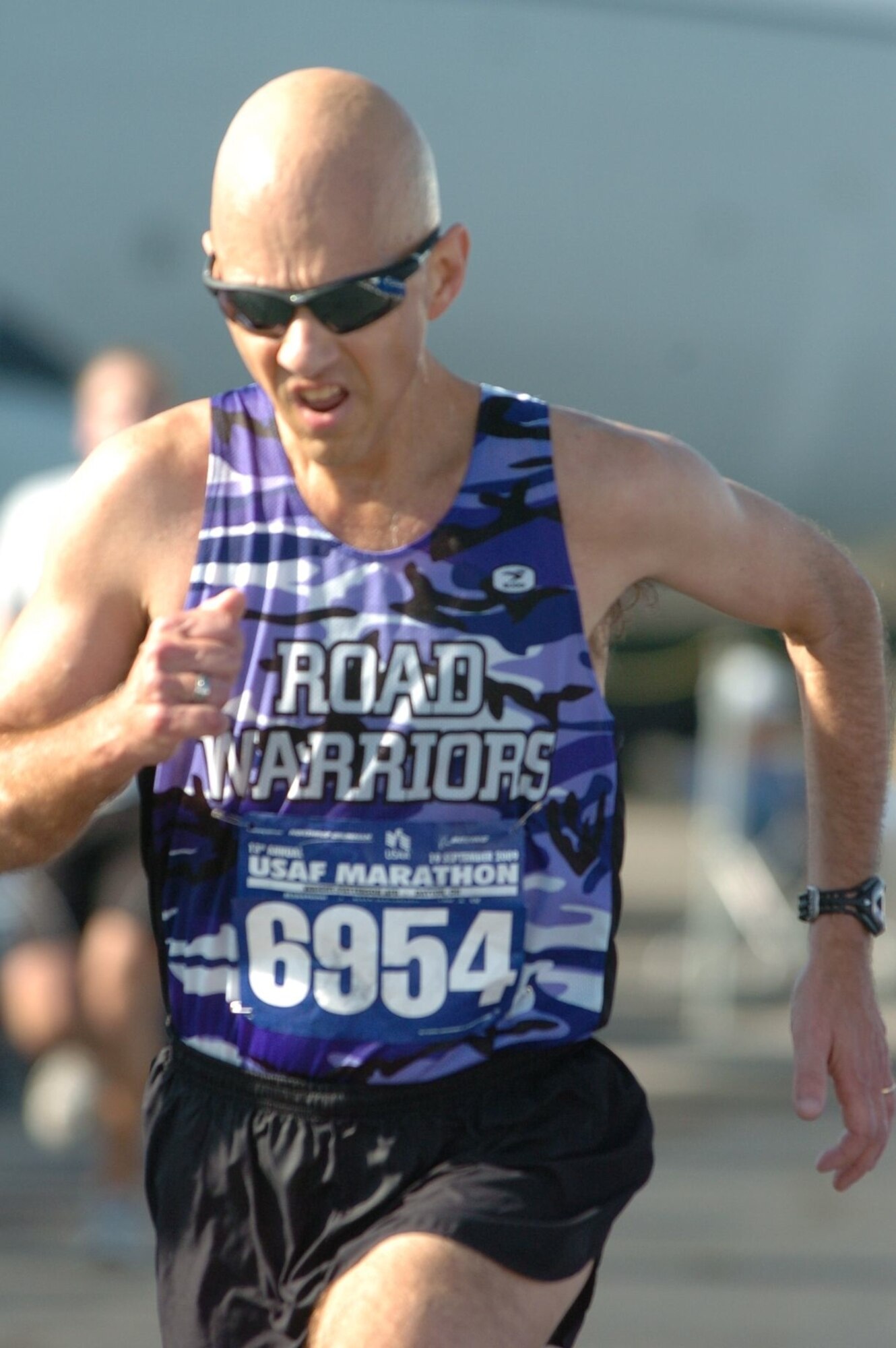 Master Sgt. Mike Sanders runs for the finish line during the U.S. Air Force Half Marathon at Wright Patterson Air Force Base, Ohio, Sept. 19.  Sergeant Sanders ran the event one year and eight months after beating cancer.  His running partner was Second Lt. Evan McNichols (not pictured), who was one of Sergeant Sanders' students when he served as an instructor with the University of Portland's Air Force Reserve Officer Training Corps program. (Photo courtesy Master Sgt. Mike Sanders.)