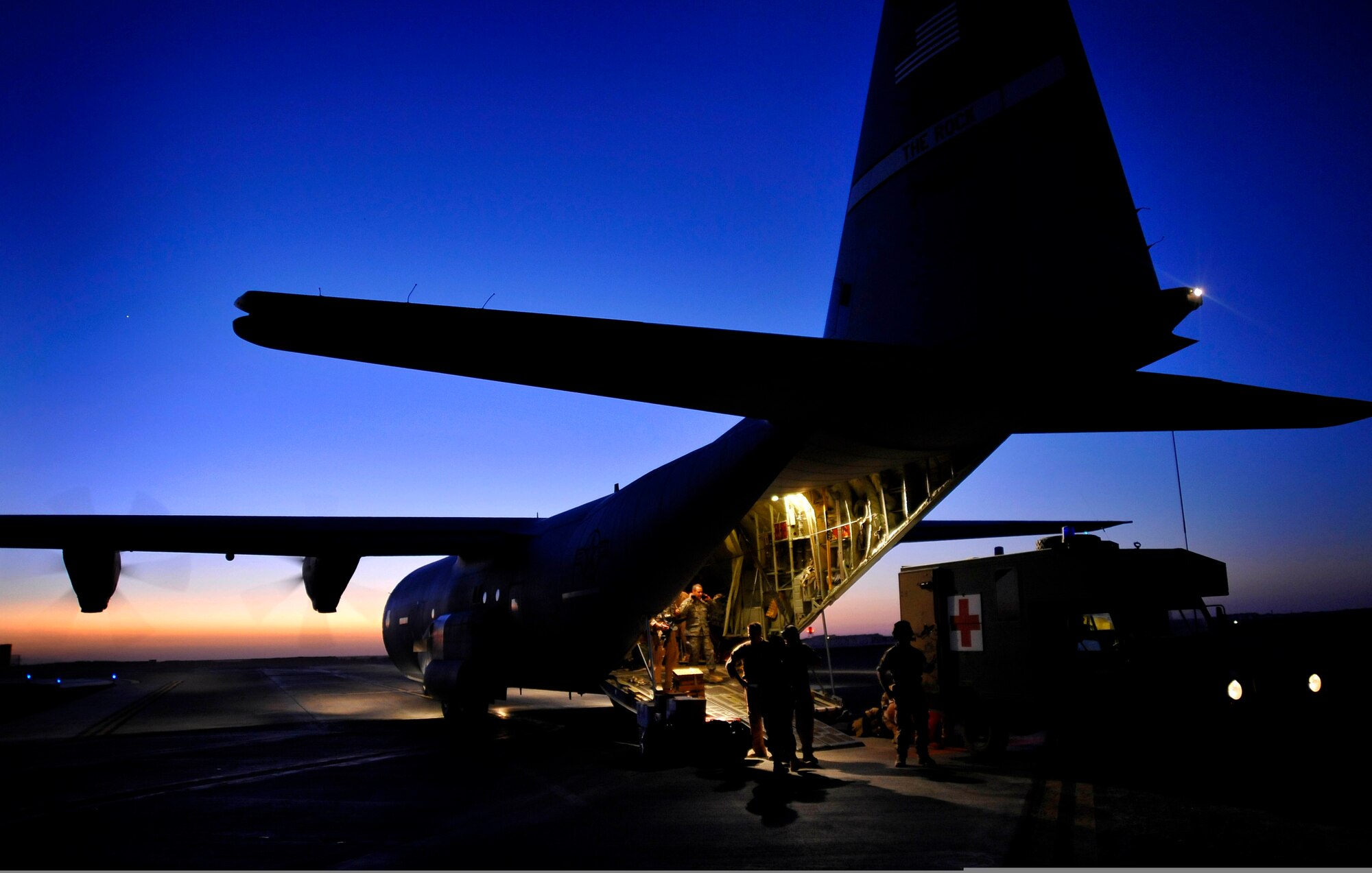 Airmen from the 451st Aeromedical Evacuation Squadron prepare a HC-130 Hercules for a mission at Kandahar Air Field, Afghanistan, on Oct. 6, 2009. During the sortie, the team will fly across Afghanistan to connect U.S., coalition and civilian patients with medical care. (U.S. Air Force Photo/Staff Sgt. Angelita Lawrence)