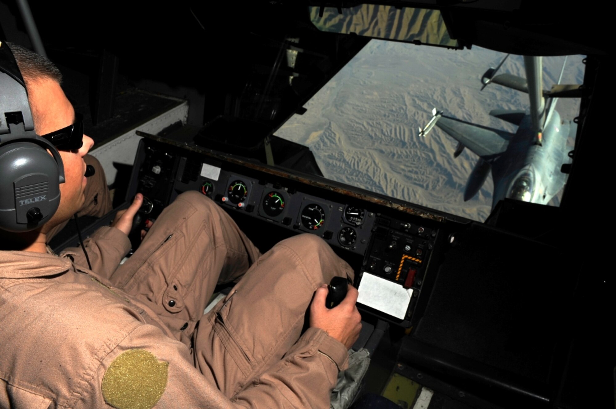 Staff Sgt. Justin Brundage, a KC-10 Extender aircraft boom operator from the 908th Expeditionary Air Refueling Squadron deployed to Southwest Asia, refuels a Royal Netherlands air force F-16 over Afghanistan on June 18, 2009. (U.S. Air Force Photo/Staff Sgt. Jason Robertson)