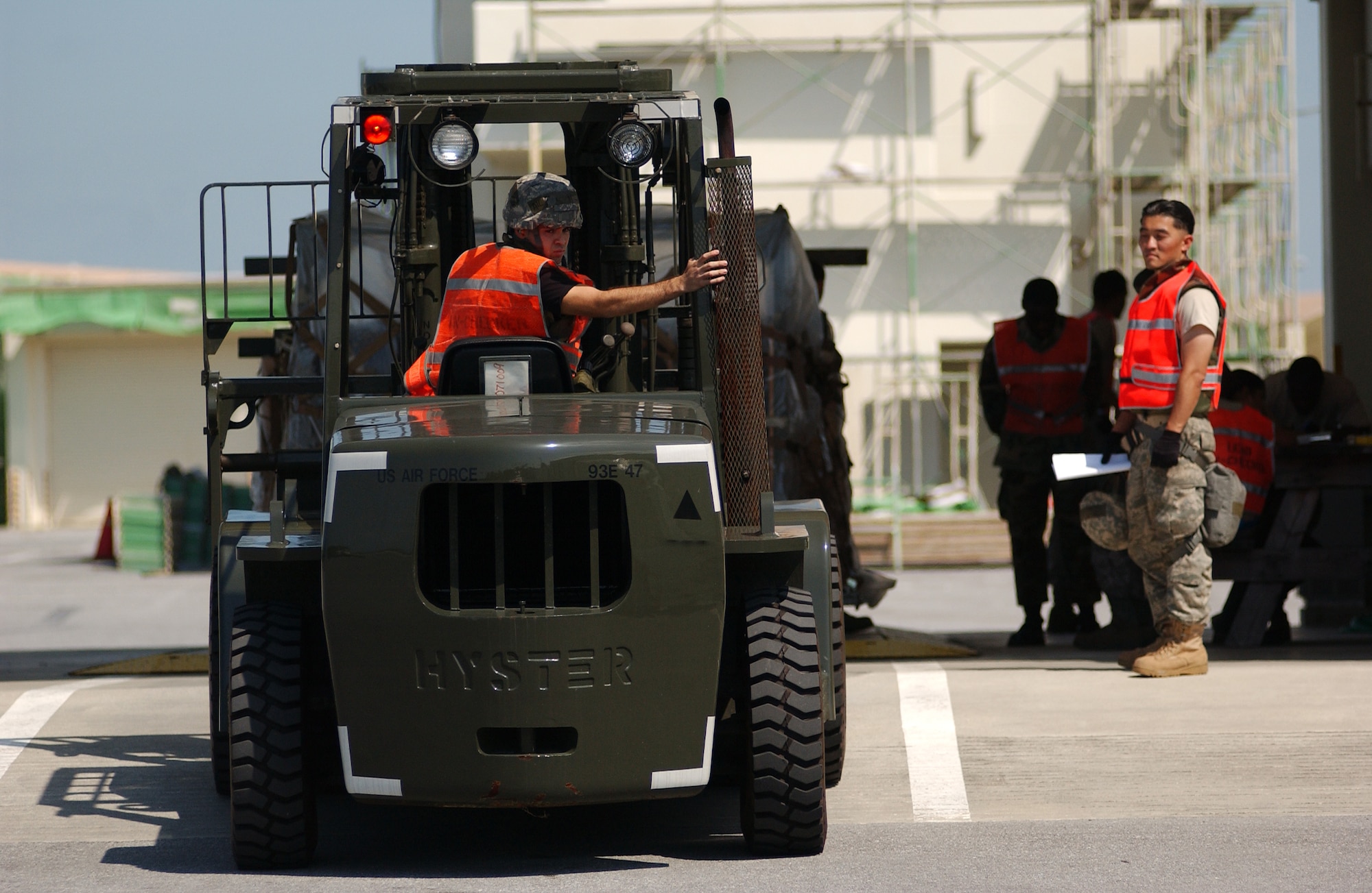 Members from the 18th Logistics Readiness Squadron weigh the palettes before placing them in their proper chalks for cargo shipping at Kadena Air Base, Japan Oct. 19 during Exercise Beverly High 10-01. The 18th Wing is participating in a Local Operational Readiness Exercise to test the readiness of Kadena Airmen Oct. 19-23. (U.S. Air Force photo/Tech. Sgt. Rey Ramon)      