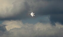 A U.S. Air Force Thunderbird F-16 flies over Osan Air Base, Republic of Korea, upon arrival Oct. 19. The Thunderbirds will be performing as part of Air Power Day here Oct. 21. (U.S. Air Force photo/Staff Sgt. Brian Ferguson)