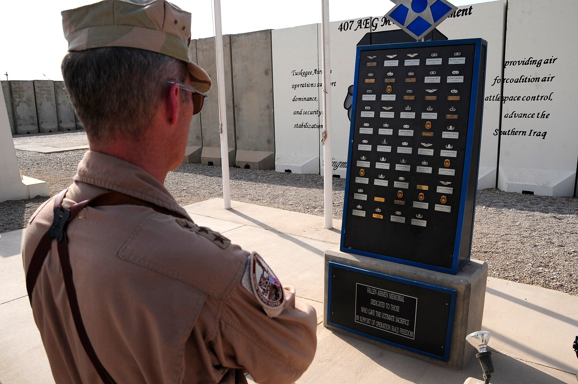 ALI BASE, Iraq – Lt. Gen. Mike Hostage, Commander, Air Force Central Command, pays tribute to Airmen who have died supporting Operation Iraqi Freedom at memorial plaza here, Oct. 17, 2009.  General Hostage had the opportunity to visit with Airmen at Ali Base for the first time as the AFCENT commander. (U.S. Air Force Photo/Senior Airman Tony R. Ritter)
