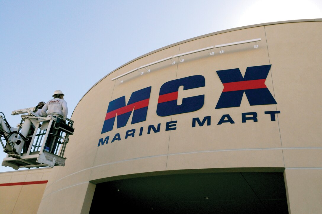 Clint Flowers, left, and Rick Leistenr, Penn Neon Sign installers, examine their work after installing the sign for the main entrance of the new Marine Corps exchange at the Marine Corps Air Station in Yuma, Ariz., Oct. 19, 2009. Construction for the building began Sept. 20, 2008, and is scheduled to finish Nov. 6. The MCX’s grand opening will run from Nov. 18-21. The new building will house the main exchange, Marine Mart, food court, barber shop, dry cleaners, tailor shop, laundromat, video rental store, GNC, Armed Forces Bank and a tickets and tours center.