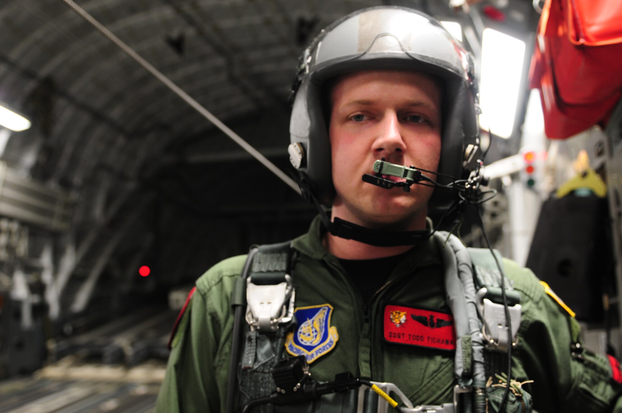 Staff Sgt. Todd Tichawa, a loadmaster from the 535th Airlift Squadron at Hickam Air Force Base, Hawaii, prepares to open the bay doors to C-17 Globemaster III, during the first combined HALO mission of exercise Cope India Oct. 19. Cope India is humanitarian assistance disaster relief exercise scheduled Oct. 19-23.  (U.S. Air Force photo by Capt. Genieve David)