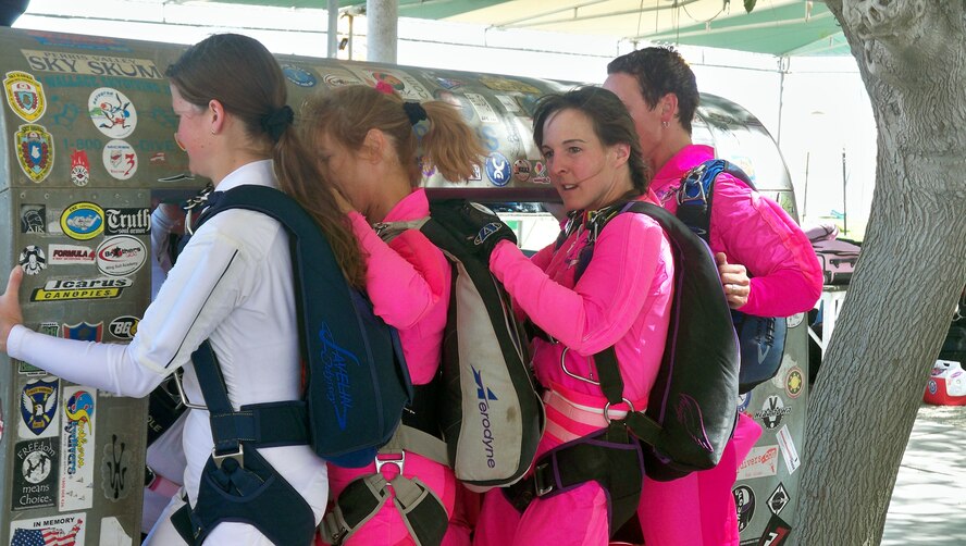 Maj. Jennifer Wrynn (third from left) practices exiting on a plane door mock-up with fellow participants at Jump for the Cause 2009, Perris Skydive, Perris, Calif., Sept. 23 (U. S. Air Force photo by Master Sgt. Linda E. Welz)