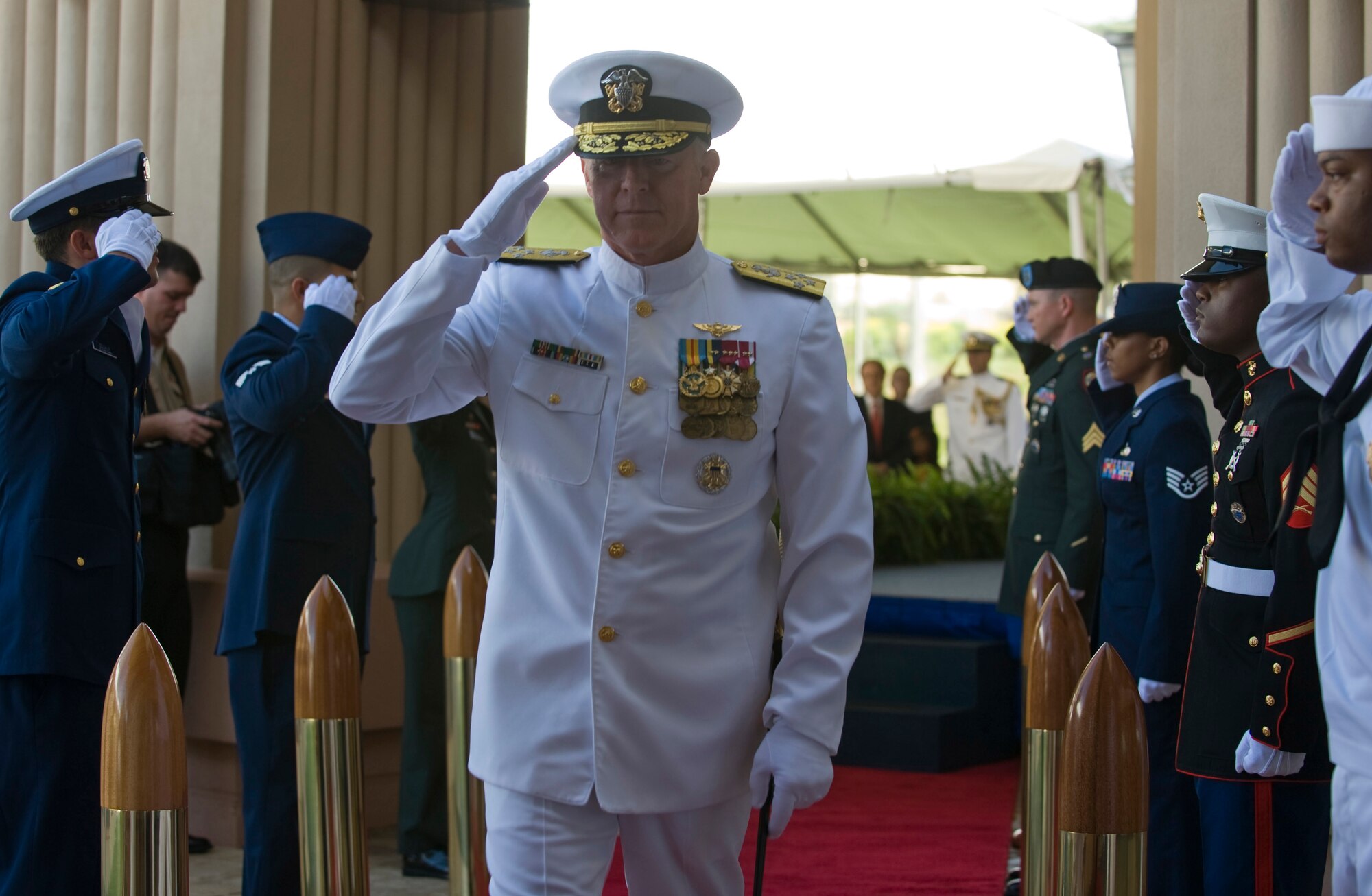 CAMP SMITH, Hawaii -- Adm. Robert F. Willard, commander of the U.S. Pacific Command, renders a salute as he passes through during a change of command ceremony held here. Willard, a former U.S. Pacific Fleet commander, assumed command of U.S. Pacific Command from Adm. Timothy J. Keating during the ceremony. (U.S. Navy photo/Mass Communications Specialist 2nd Class Elisia V Gonzales)