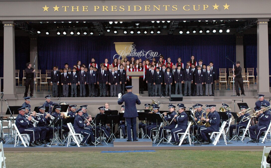 The United States Air Force Band of the Golden West performed for the Professional Golfers Association Presidents Cup Tournament opening ceremony Oct. 7 at Harding Park in San Francisco. More than 4,000 audience participants and 1.2 million television viewers watched the Band of the Golden West play festive ceremonial music before opening remarks were made. 

The Band of the Golden West was asked to perform at the Presidents Cup, through coordination with Richard Kaufman, PGA music director. Under the direction of Major Keith Bland, commander, Band of the Golden West, the band performed nine musical selections including the Star Spangled Banner for the crowd. “It was an honor to represent the Armed Forces and the Air Force,” said Major Bland. “We’re proud to serve as ambassadors of all the men and women in uniform.” Cheers from the crowd reiterated the love of music for the band members.

 Staff Sergeant Jill Corbett, tuba player, Band of the Golden West, expressed her appreciation for the warm crowd reception. “It rejuvenates my love for the job,” she said. “We received excellent exposure, and it was great for our unit and the entire Air Force.”Many prominent guests attended the opening ceremony including President George H.W. Bush Sr., Major League Baseball player Barry Bonds and San Francisco opera singer Zheng Cao. Members of the U.S. team included Phil Mickelson and Tiger Woods.

The Band of the Golden West is the only active-duty band west of the Rocky Mountains and contains multiple elements including a concert band, caroling band for the holidays, brass and woodwind quintets and a rock band. An ensemble of the large concert band performed at the tournament, playing upbeat marches and fanfares for the audience. Comprised of 45 to 49 members, the band supports 10 Air Force bases in the western states including Nevada, Oregon, Idaho and Washington. They perform an average of 200 performances a year. “We represent excellence that exists throughout the Air 