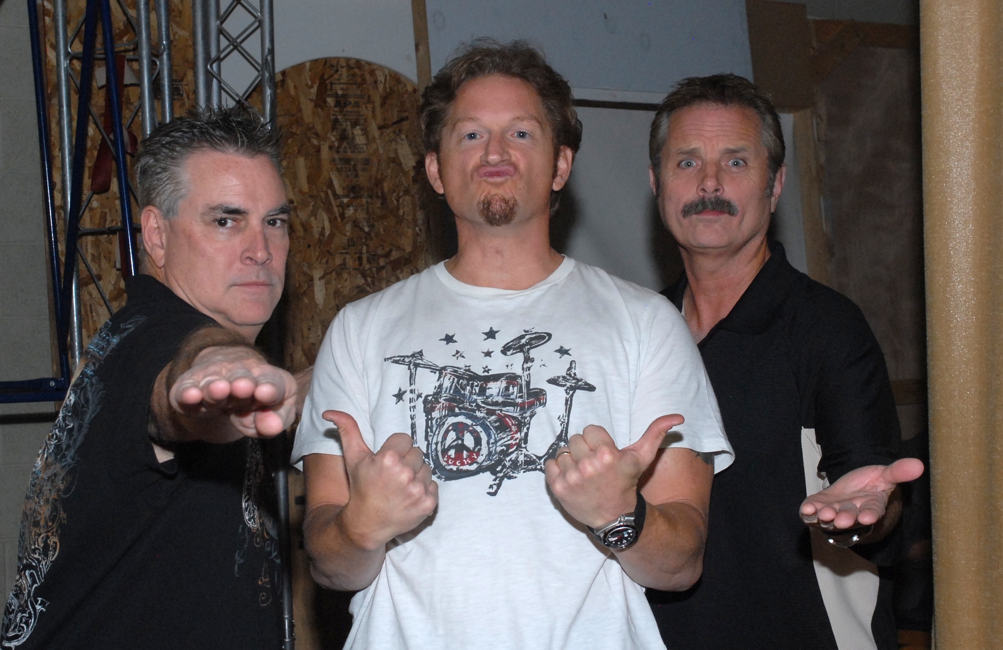 Tim & Willy from KMLE country music station and Tim Hawkins, standup comedian, pose for the camera before the comedy show at the Luke Air Force Base Theatre, October 15, 2009.  The Luke Air Force Base Chapel and Club Communities held the event with hosts Tim & Willy from KMLE country music station. (U.S. Air Force photo by Airman 1st Class Sandra Welch)  