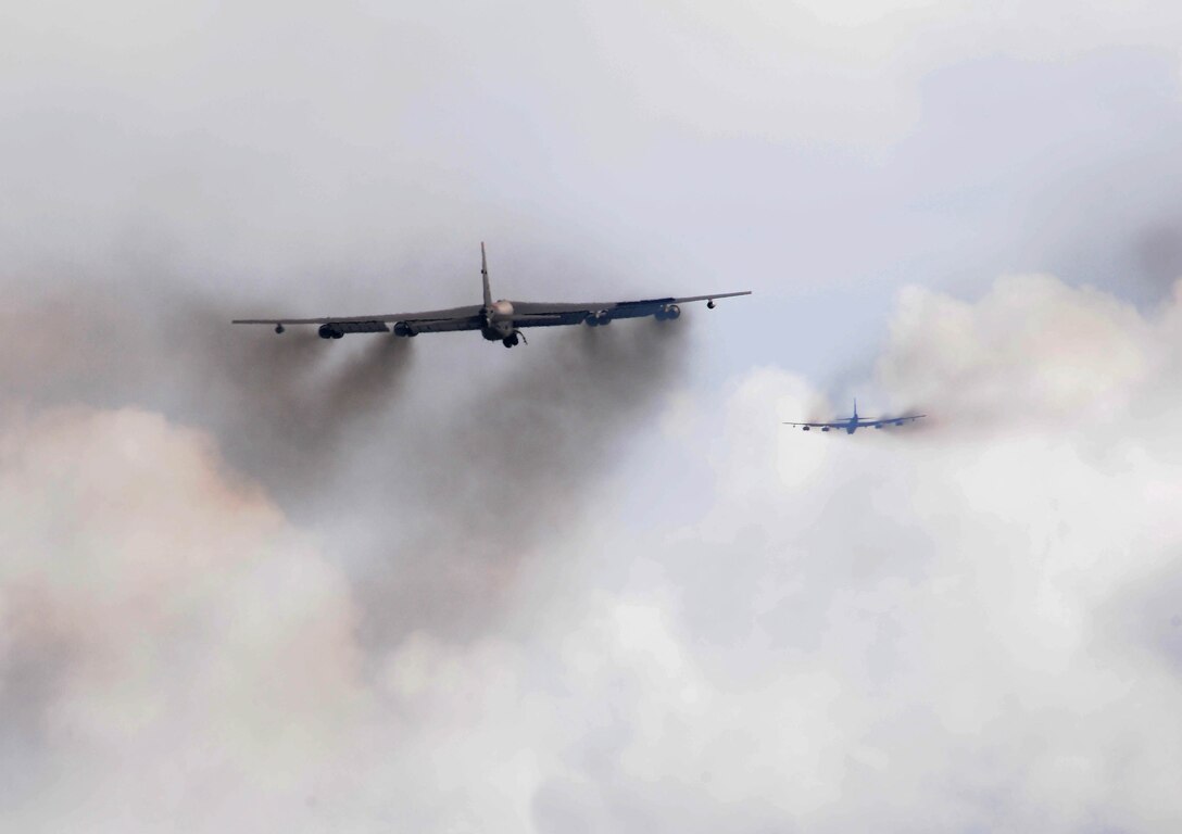 Two B-52 Stratfortresses from the 20th Expeditionary Bomb Squadron fly high above Andersen Air Force Base, Guam after take-off here Oct. 14. The 20th BS, from Barksdale Air Force Base, La., deployed here with six B-52s to support Pacific Air Forces Continues Bomber Presence and Theater Security Package in the Asia-Pacific region. (U.S. Air Force photo/ Senior Airman Nichelle Anderson)