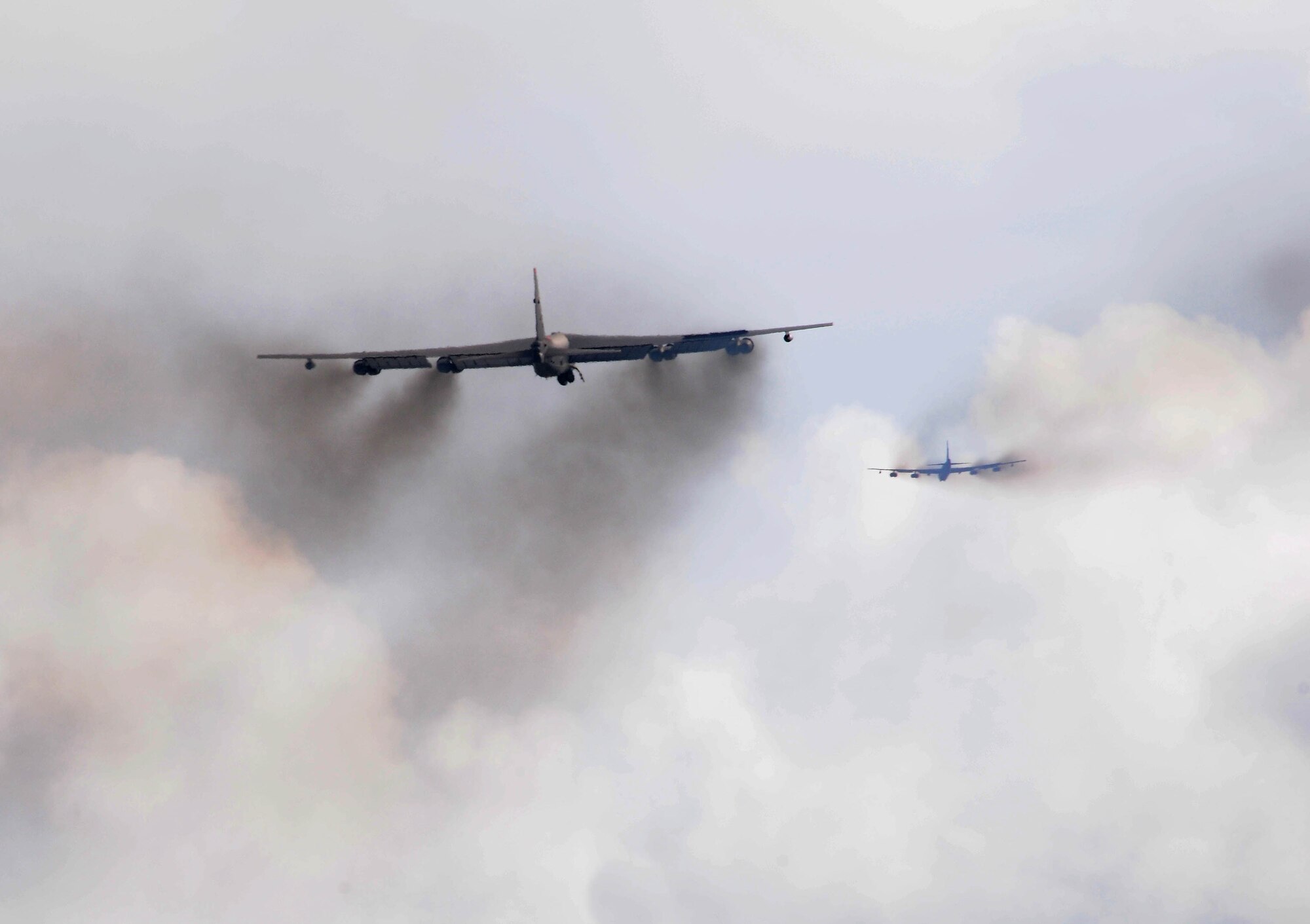 Two B-52 Stratfortresses from the 20th Expeditionary Bomb Squadron fly high above Andersen Air Force Base, Guam after take-off here Oct. 14. The 20th BS, from Barksdale Air Force Base, La., deployed here with six B-52s to support Pacific Air Forces Continues Bomber Presence and Theater Security Package in the Asia-Pacific region. (U.S. Air Force photo/ Senior Airman Nichelle Anderson)