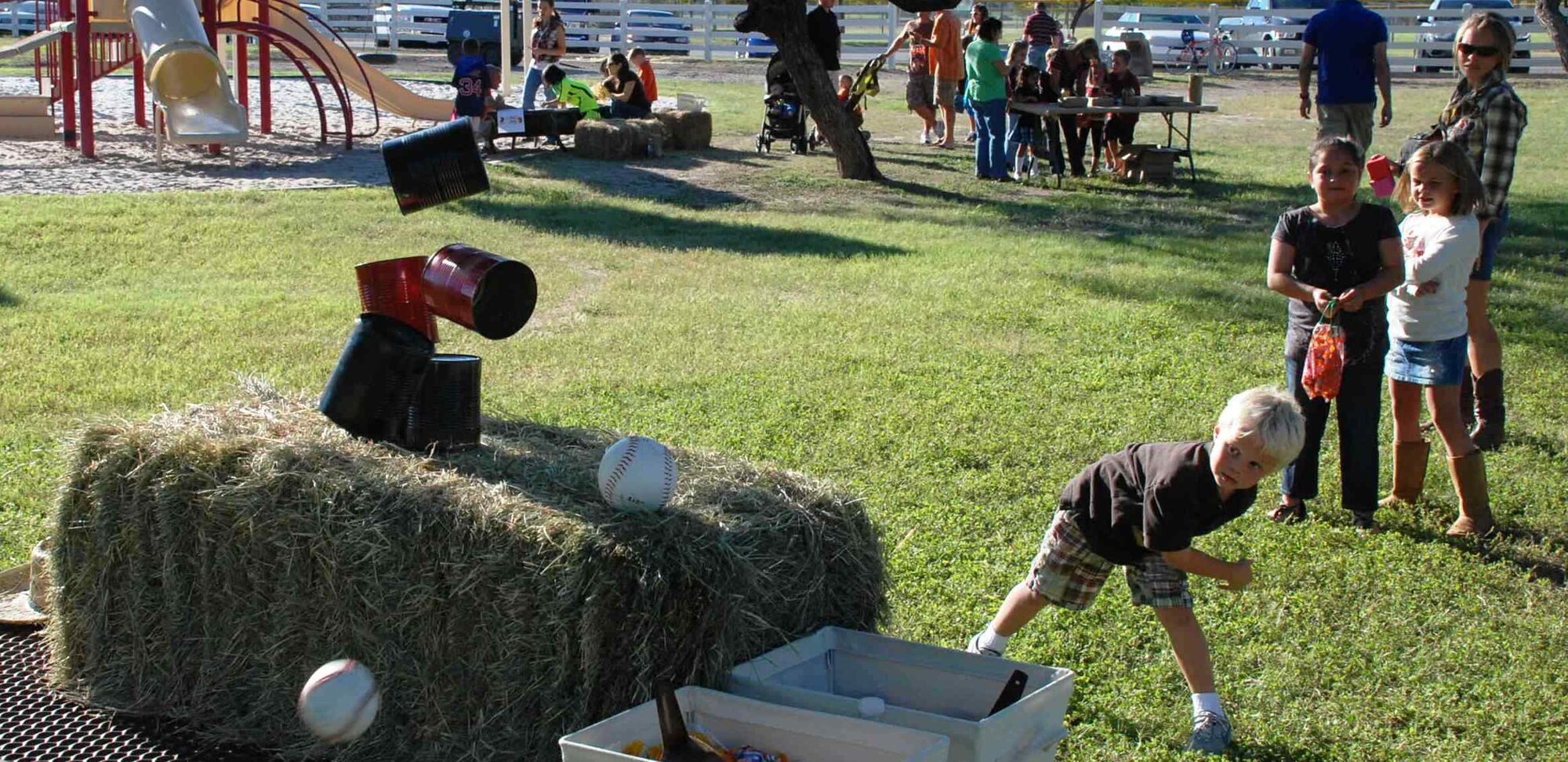 LAUGHLIN AIR FORCE BASE, Texas – Jackson Duke follows through after successfully knocking down his target at the ball-toss event at the annual fall festival here Oct. 17. The festival was hosted by the Laughlin Officers’ Spouses’ Club, which uses the money raised to assist in causes that benefit the Laughlin and Del Rio communities in a number of ways, including providing scholarships for local high school seniors and military spouses. (U.S. Air Force photo by Airman 1st Class Blake Mize)