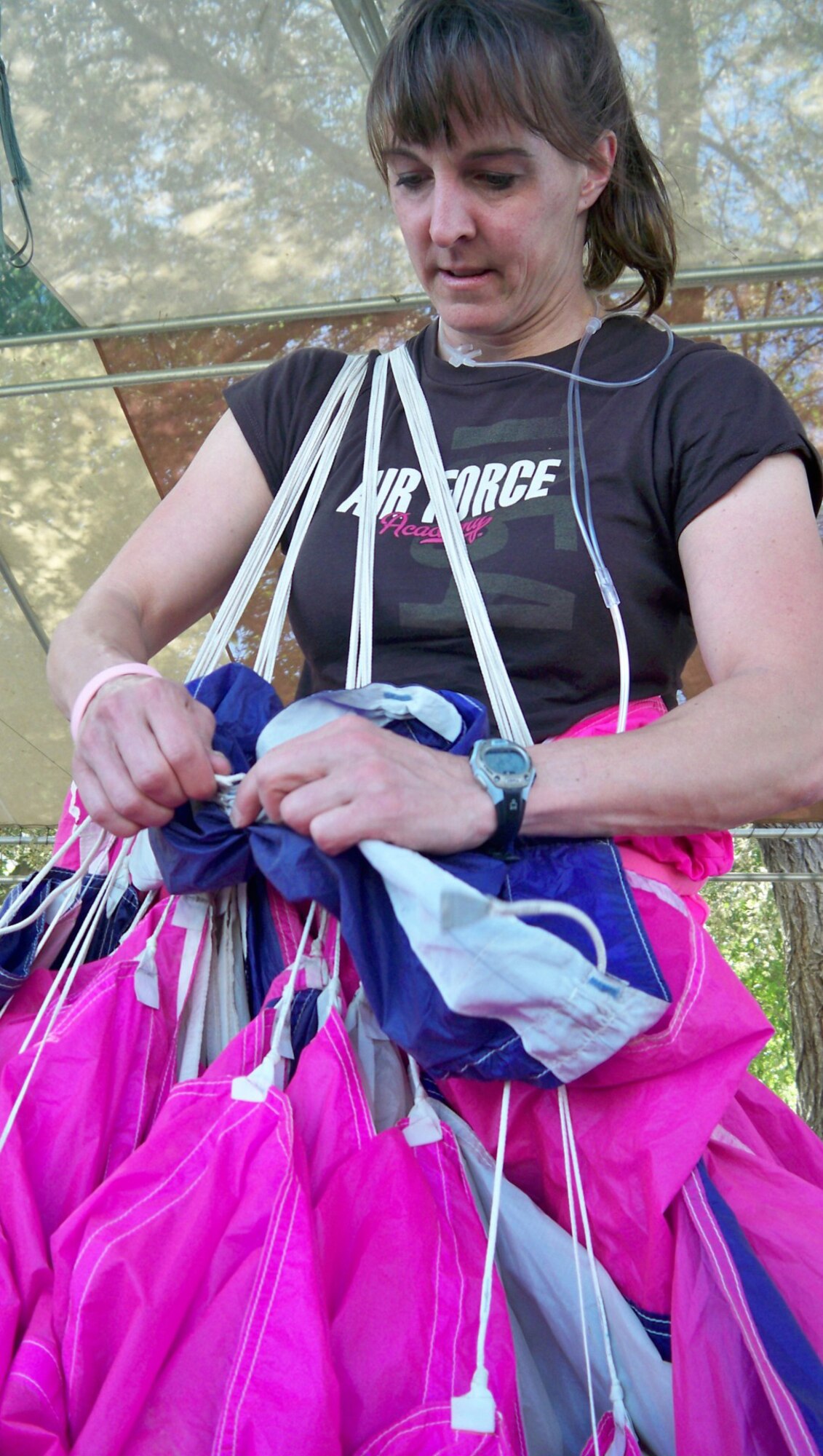 Lt. Col. (select) Jennifer Wrynn, a Reserve U.S. Air Force Academy instructor, jumpmaster and pilot, packs her parachute following ajump at Perris Skydive, Perris, Calif., Sept. 23.  She was part of a 181 all-female skydive formation that set a new world record.  (U.S. Air Force photo/Master Sgt. Linda E. Welz)