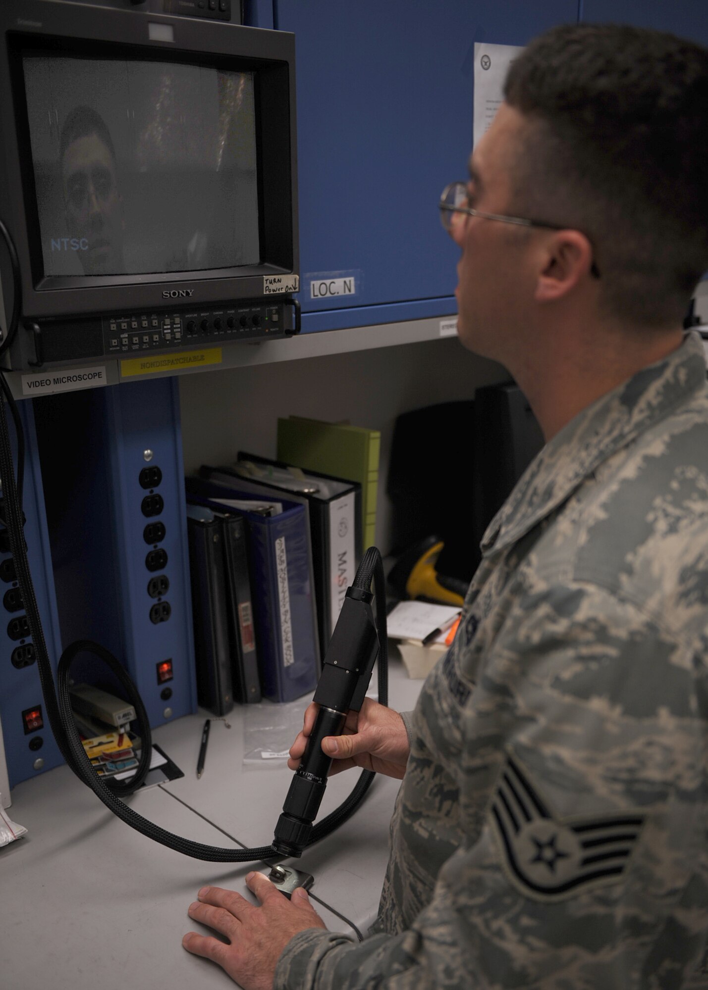 Staff Sgt. Justin Varrato, 4th Equipment Maintenance Squadron non-destructive inspector, inspects a breech bolt for cracks with a video microscope on Seymour Johnson Air Force Base, N.C., Oct. 16, 2009. A breech bolt attaches to a shafting assembly found in gas-operated firearms commonly used on the F-15E Strike Eagle . (U.S. Air Force photo/Senior Airman Ciara Wymbs) 
