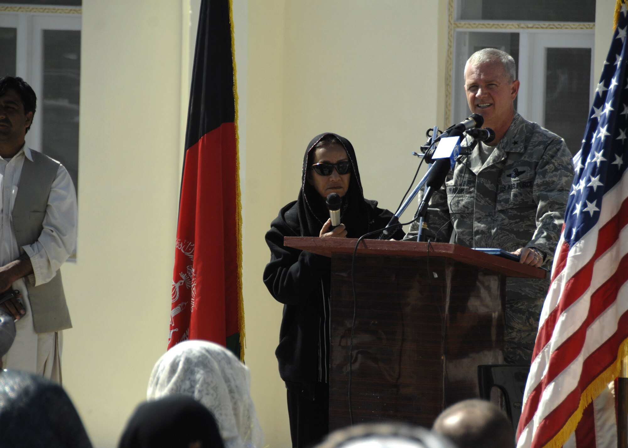 ZABUL PROVINCE, Afghanistan -- Brigadier General Guy Walsh, 451st Air Expeditionary Wing commander, addresses the audience during a ceremony at the newly built girls' school house in Zabul Province, Afghanistan, Oct. 19, 2009. Funded by the Zabul Provincial Reconstruction Team, the construction of an additional school house with eight rooms will allow more than 400 students of the primary school to attend classes in buildings rather than tents.  (U.S. Air Force photo/Senior Airman Timothy Taylor)
