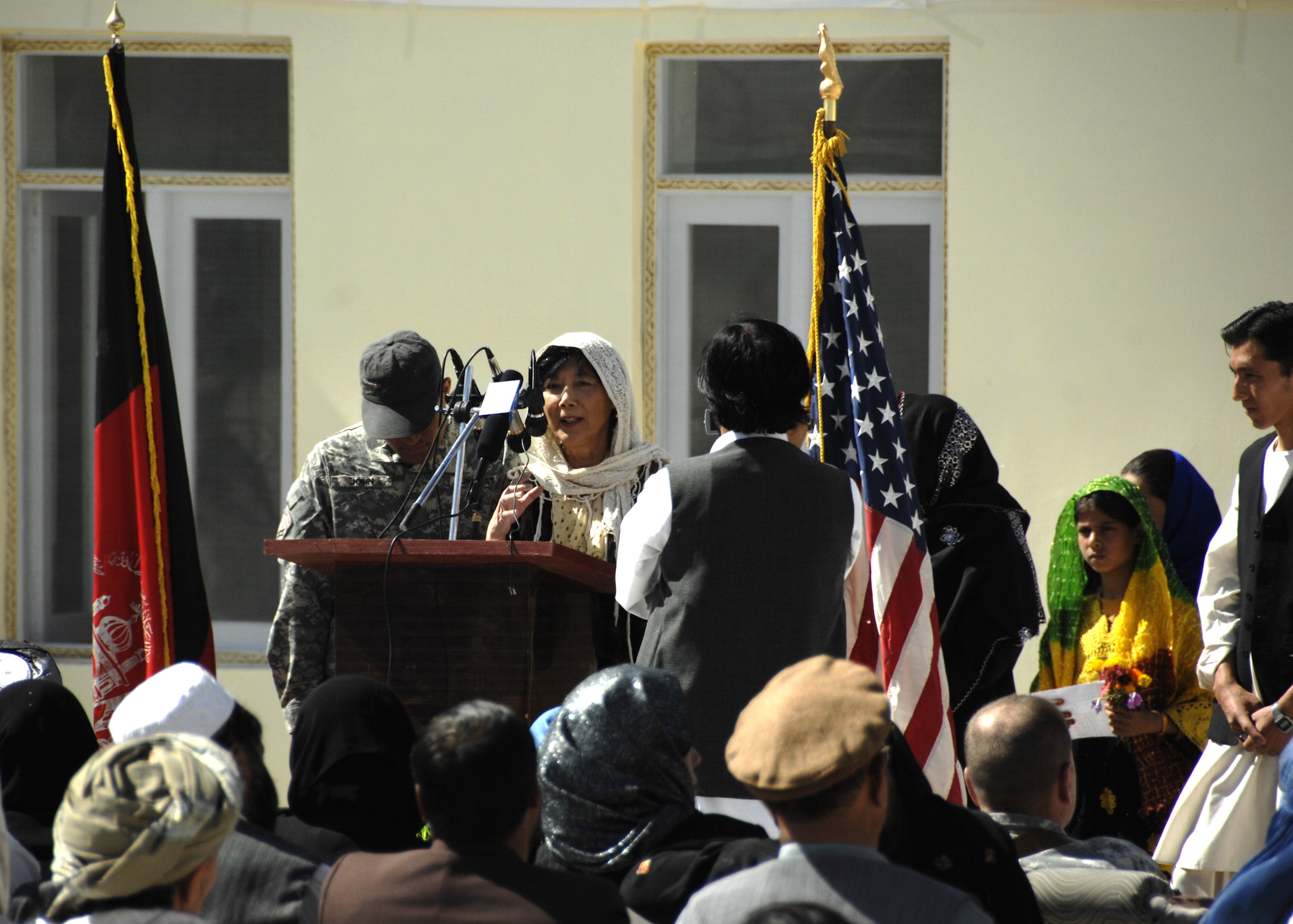 ZABUL PROVINCE, Afghanistan -- Ching Eikenberry, wife of Karl Eikenberry, the U.S. ambassador of Zabul Province, speaks of the importance of education for women during the opening ceremony, Oct. 19, 2009. Currently, the literacy rate of women in Afghanistan is less than one percent, and the opening of an all girls' school shows a great deal of progression for the Afghan people. (U.S. Air Force photo/Senior Airman Timothy Taylor)