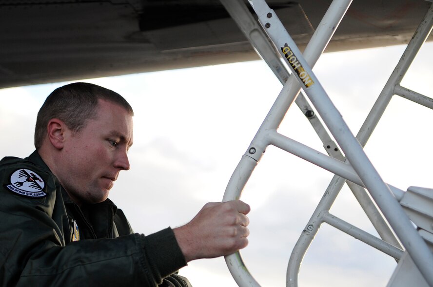 ELLSWORTH AIR FORCE BASE, S.D.--Capt. Nick Brooks, 34th Bomb Squadron B-1B Lancer weapons systems officer, boards a B-1B Lancer, Oct. 15. As a weapons systems officer, Capt. Brooks works with the pilots and other weapons systems officers to collectively achieve and maintain crew efficiency, situational awareness and mission effectiveness. (U.S. Air Force photo/Airman 1st Class Corey Hook)