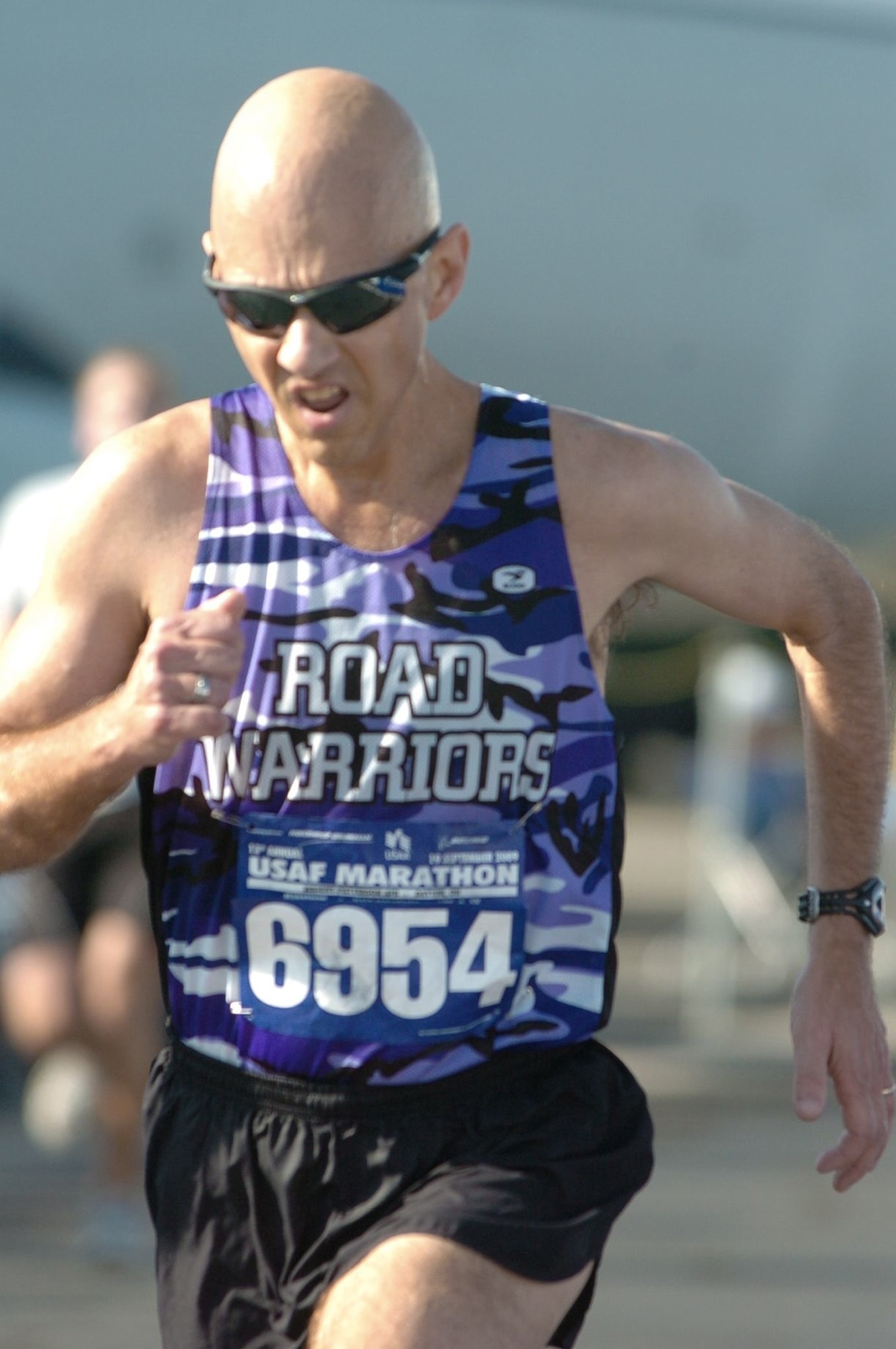 Master Sgt. Mike Sanders runs for the finish line during the Air Force Half Marathon Sept. 19, 2009, at Wright-Patterson Air Force Base, Ohio. Sergeant Sanders ran the event one year and eight months after beating cancer. (Courtesy photo) 