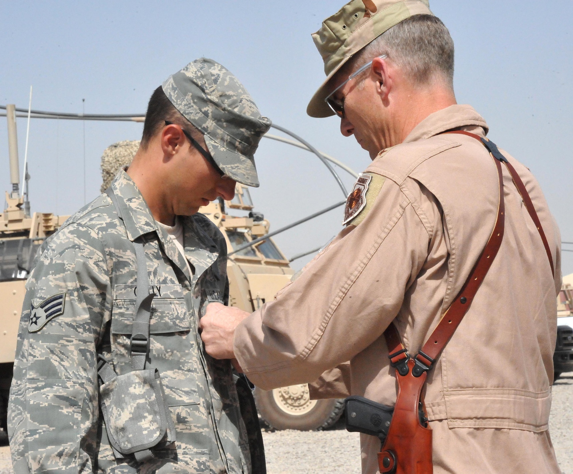 Senior Airman Jon C. Galley, 325th Security Forces Squadron Airman received the Purple Heart on Sept. 28 from Lt. Gen. Mike Hostage, U.S. Air Central Command Commander. (U.S. Air Force photo by Airman 1st Class Rachelle Elsea)