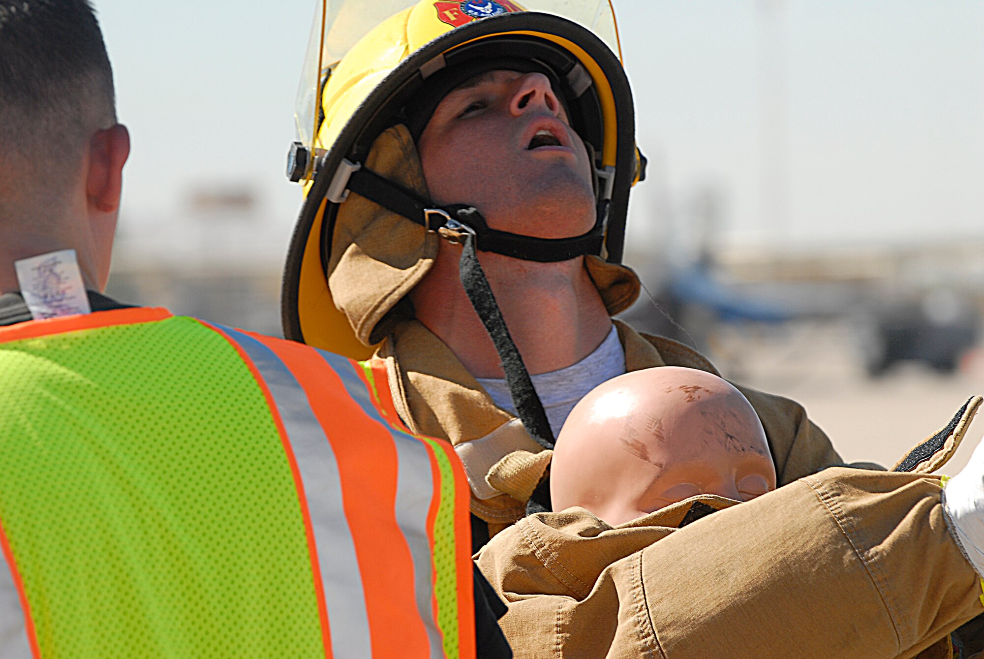 Airman 1st Class James Costello, 56th Security Forces Squadron patrolman, drags a 135 pound dummy across the finish line during the Firefighter Combat Challenge Oct. 16. Airman 1st Class Costello completed the challenge in one minute forty-seven seconds.  (U.S. Air Force photo by Airman 1st Class Ronifel Yasay)